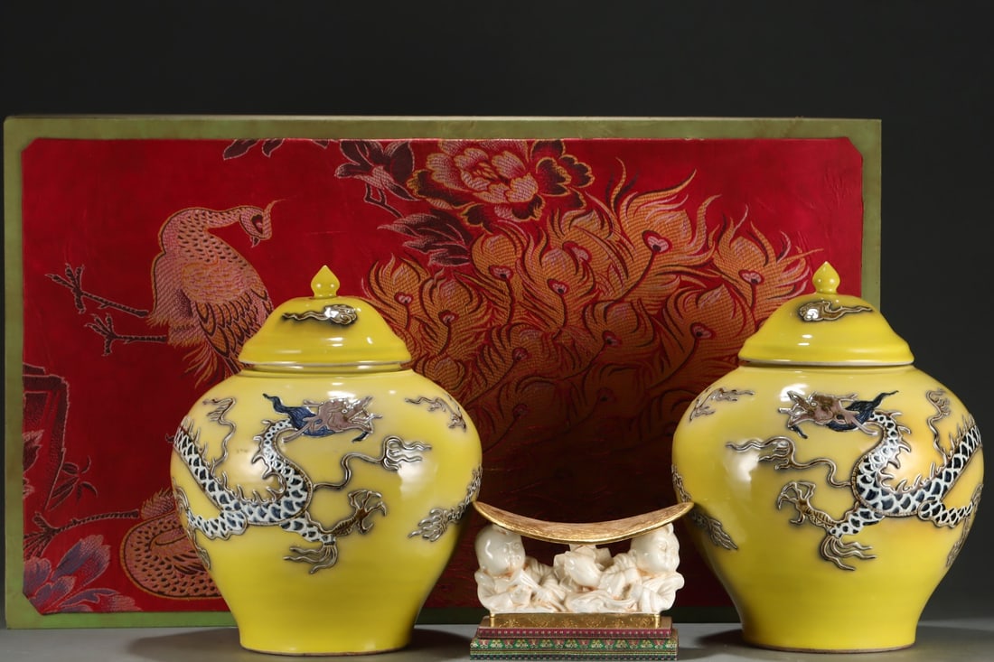 An Exquisite Yellow Glazed Dragon Pattern Jar: An Exquisite Yellow Glazed Dragon Pattern Jar Yuan Dynasty, China Size:15.9inx12.8in黄釉浮雕龙纹盖罐 中国元代 Size:40.5cmx32.5cm