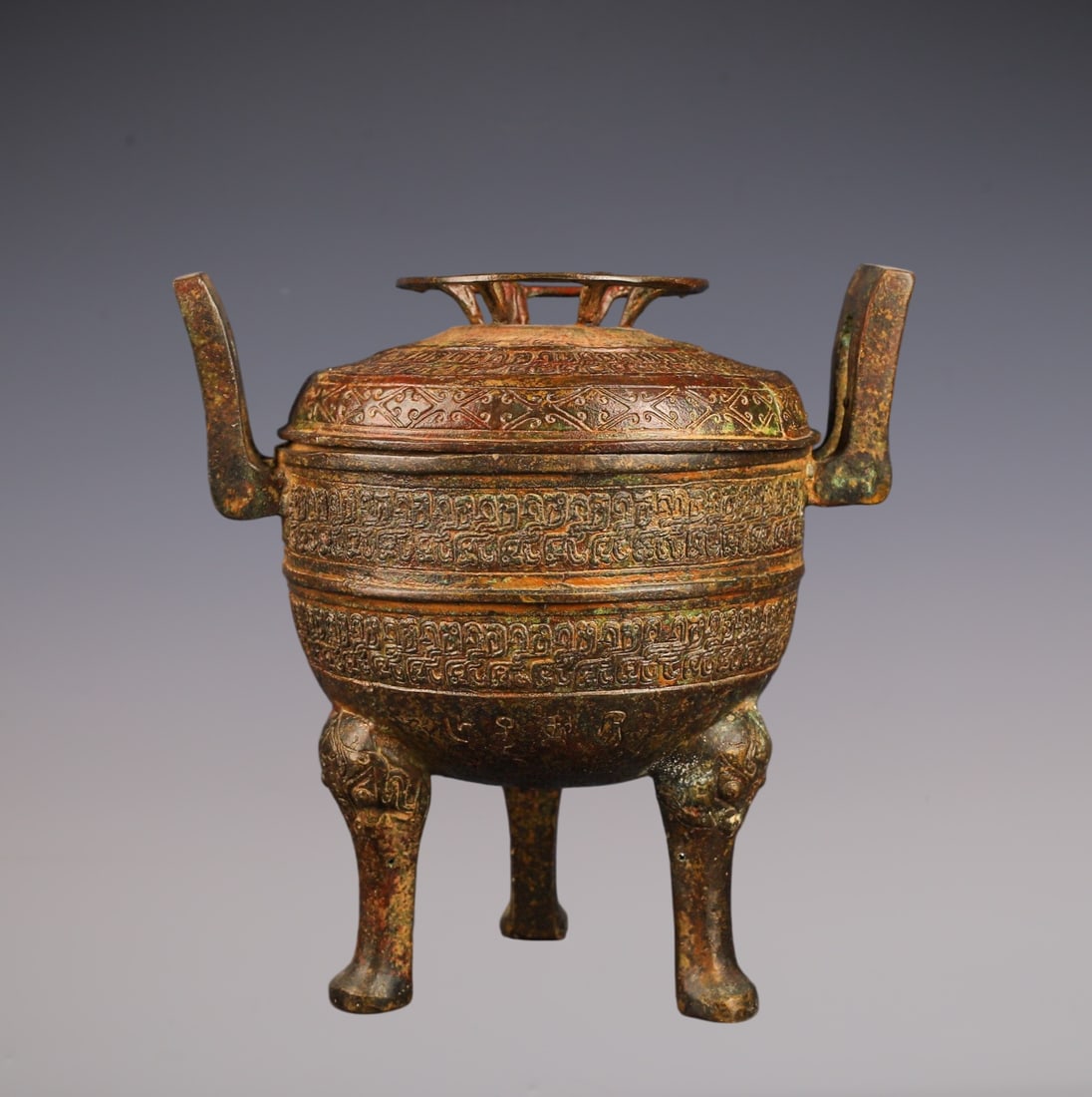 An Archaic Bronze Dragon Pattern Double-Ears and Tripod Censer,With Inscription: An Archaic Bronze Dragon Pattern Double-Ears and Tripod Censer,With Inscription,the Spring and Autumn in Period in China,Size:7.5inx4.7inx7.5in,Weight:1800g青铜龙纹双 