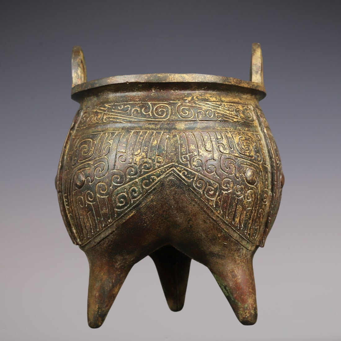 An Archaic Bronze Beast-Face Pattern Double-Ears and Tripod Censer,With Inscription: An Archaic Bronze Beast-Face Pattern Double-Ears and Tripod Censer,With Inscription,W.Zhou ,China,Size:8.7inx11.4in,Weight:4200g青铜兽面纹双耳三足