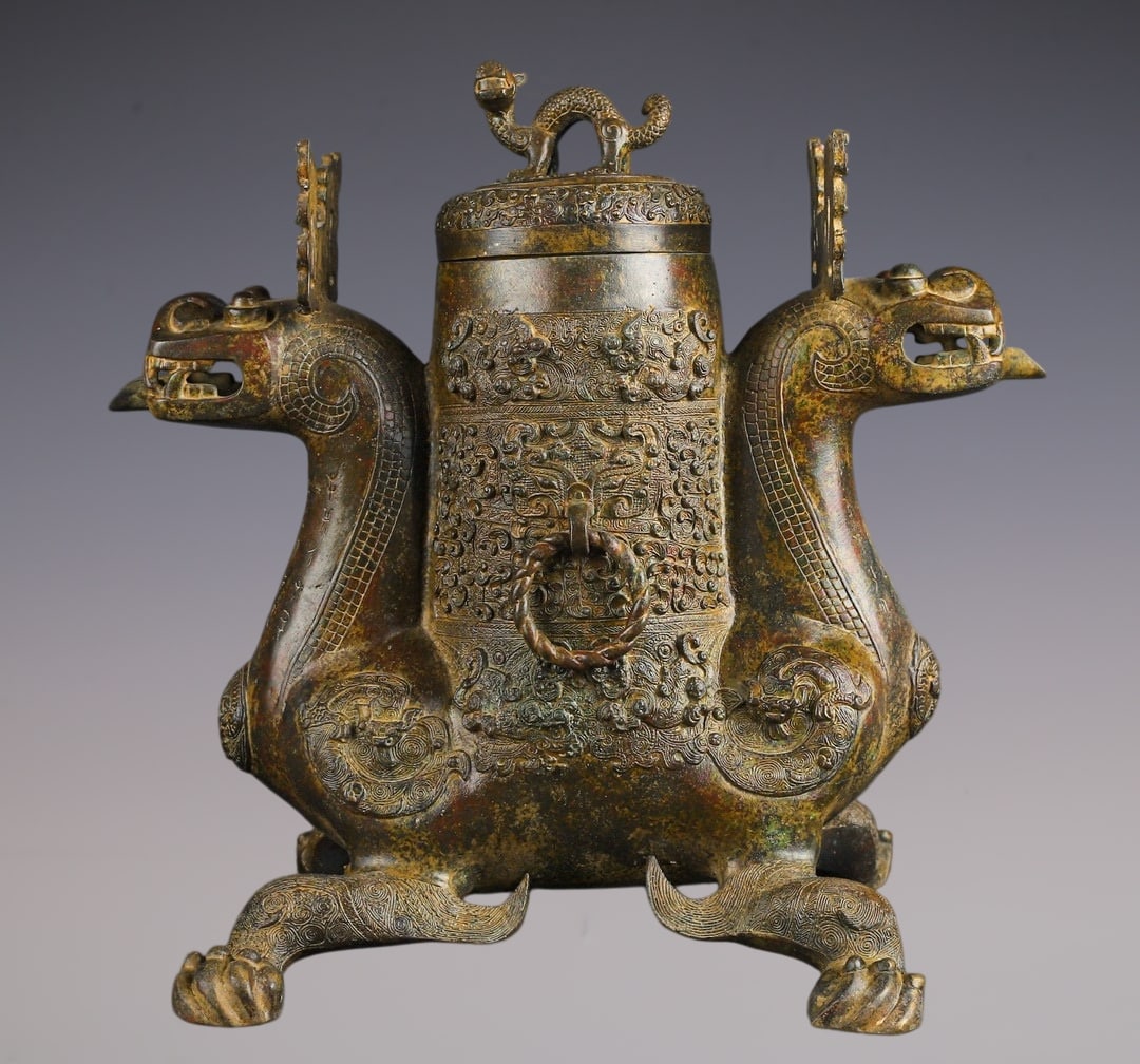 An Archaic Bronze Beast-Face Pattern Beast-Shaped Vase,With Inscription: An Archaic Bronze Beast-Face Pattern Beast-Shaped Vase,With Inscription,W.Zhou ,China,Size:16.5inx15.7in,Weight:8800g青铜兽面纹兽形瓶,带铭&#