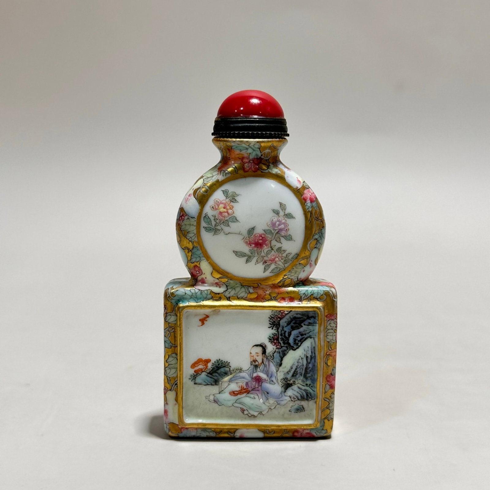 An Exquisite Enamel Painted Gold Character and Story Pattern Snuff Bottle (1 of 10)