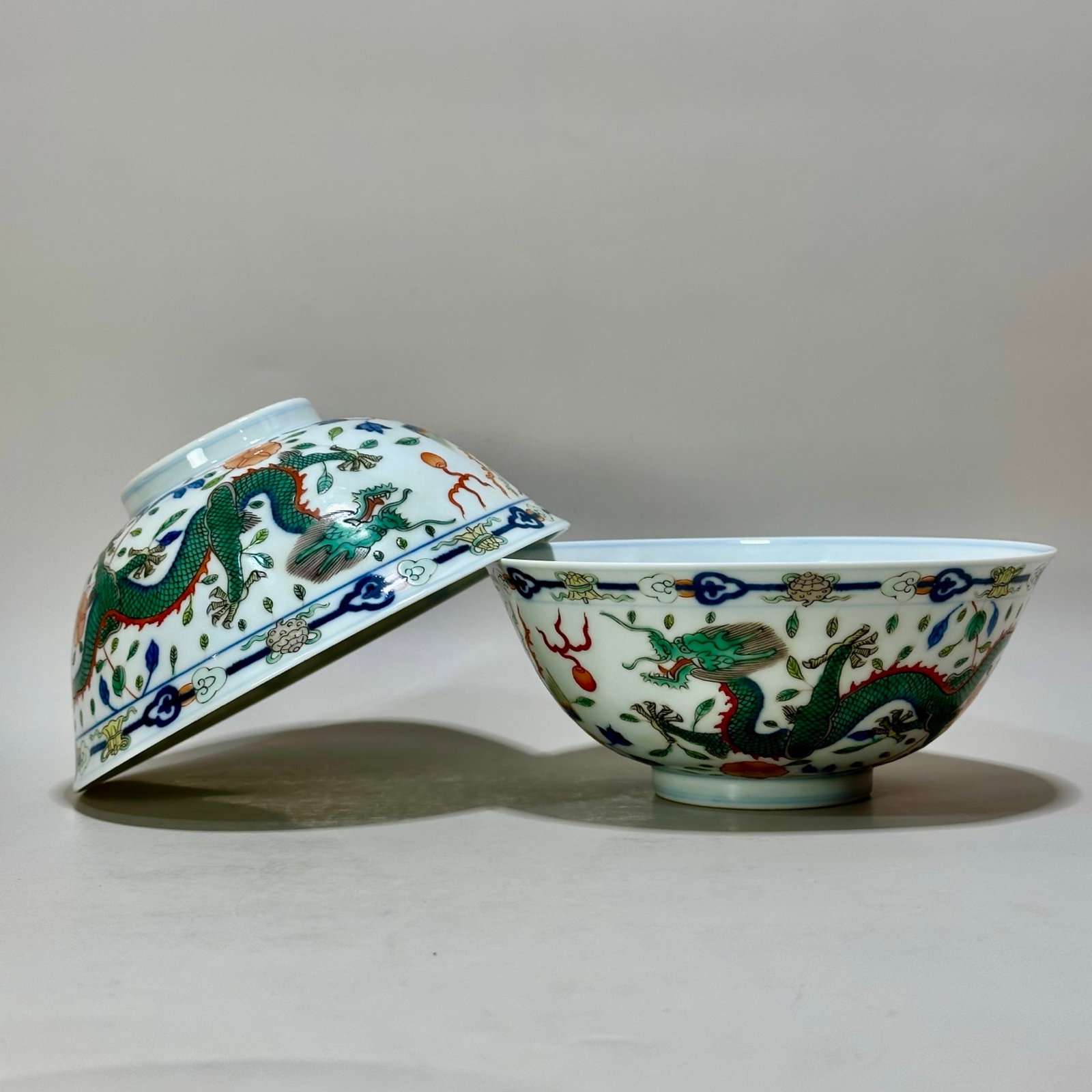 A Pair of Exquisite Blue and White Doucai Dragon and Phoenix Pattern Bowls: A Pair of Exquisite Blue and White Doucai Dragon and Phoenix Pattern Bowls,Qing Dynasty,China,Qianlong Six-character Mark,Size:2.7inx6.3in 一对青花斗彩龙Ñ