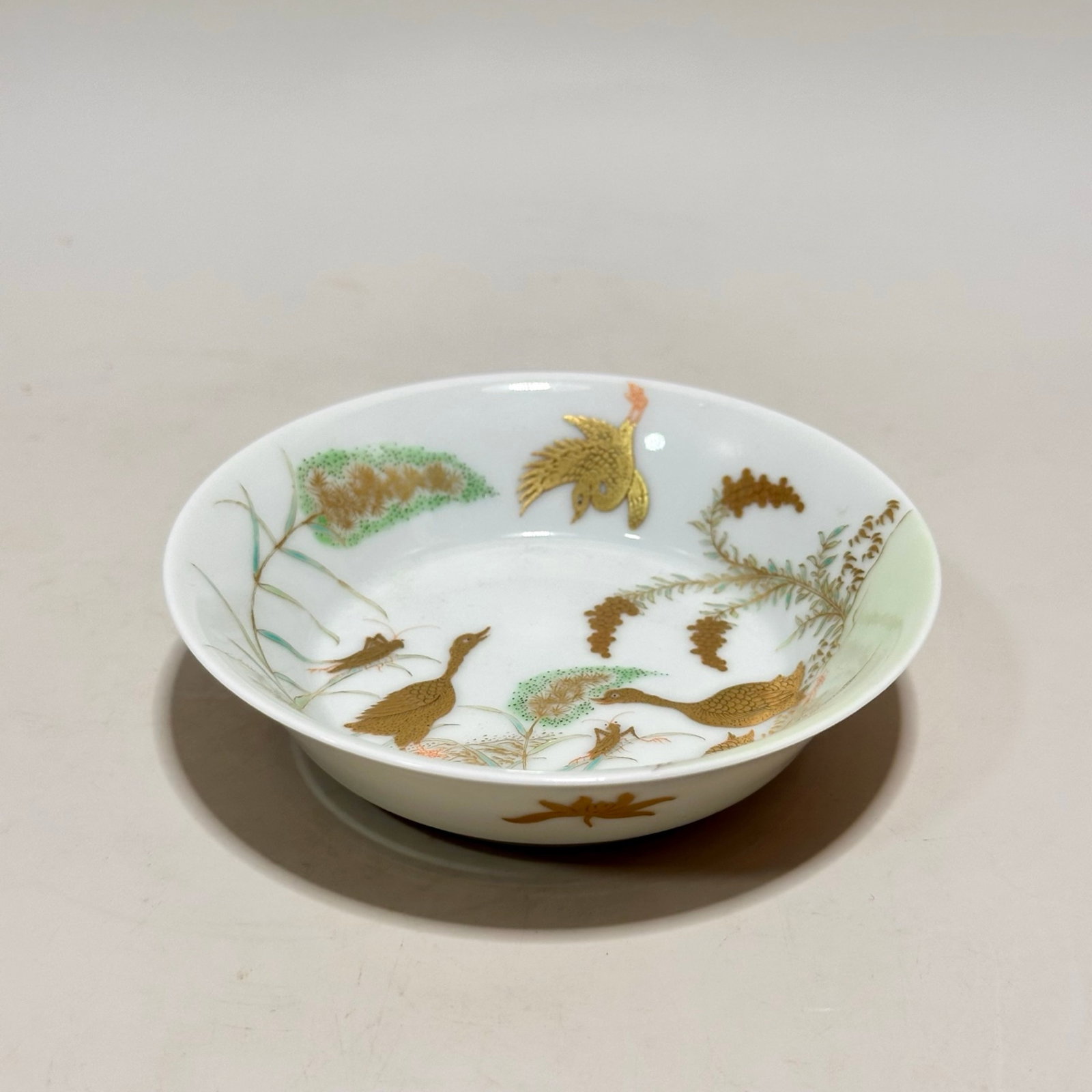 An Exquisite Famille-Rose Painted Gold Reed Goose Pattern Plate: An Exquisite Famille-Rose Painted Gold Reed Goose Pattern Plate,Qing Dynasty,China,Yongzheng Six-character Mark,Size:1.1inx3.9in 粉彩描金芦雁纹盘子