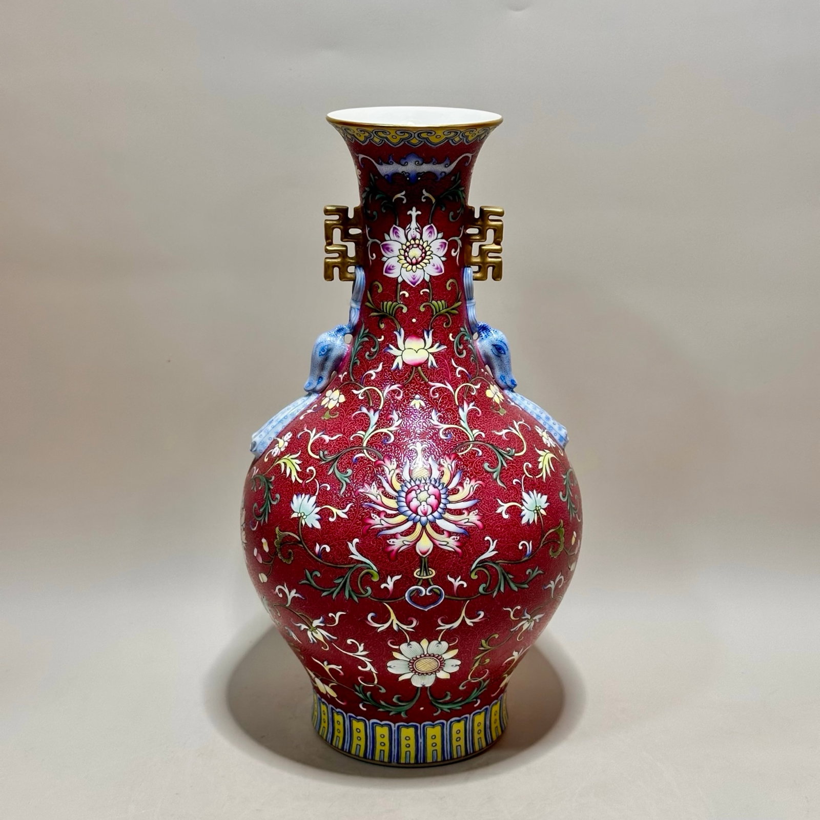 A Rare Red Ground Enamel Lotus Pattern Double-Ears Vase: A Rare Red Ground Enamel Lotus Pattern Double-Ears Vase,Qing Dynasty,China,Qianlong Six-character Mark,Size:13.2inx7.3in 红地珐琅彩缠枝莲纹双