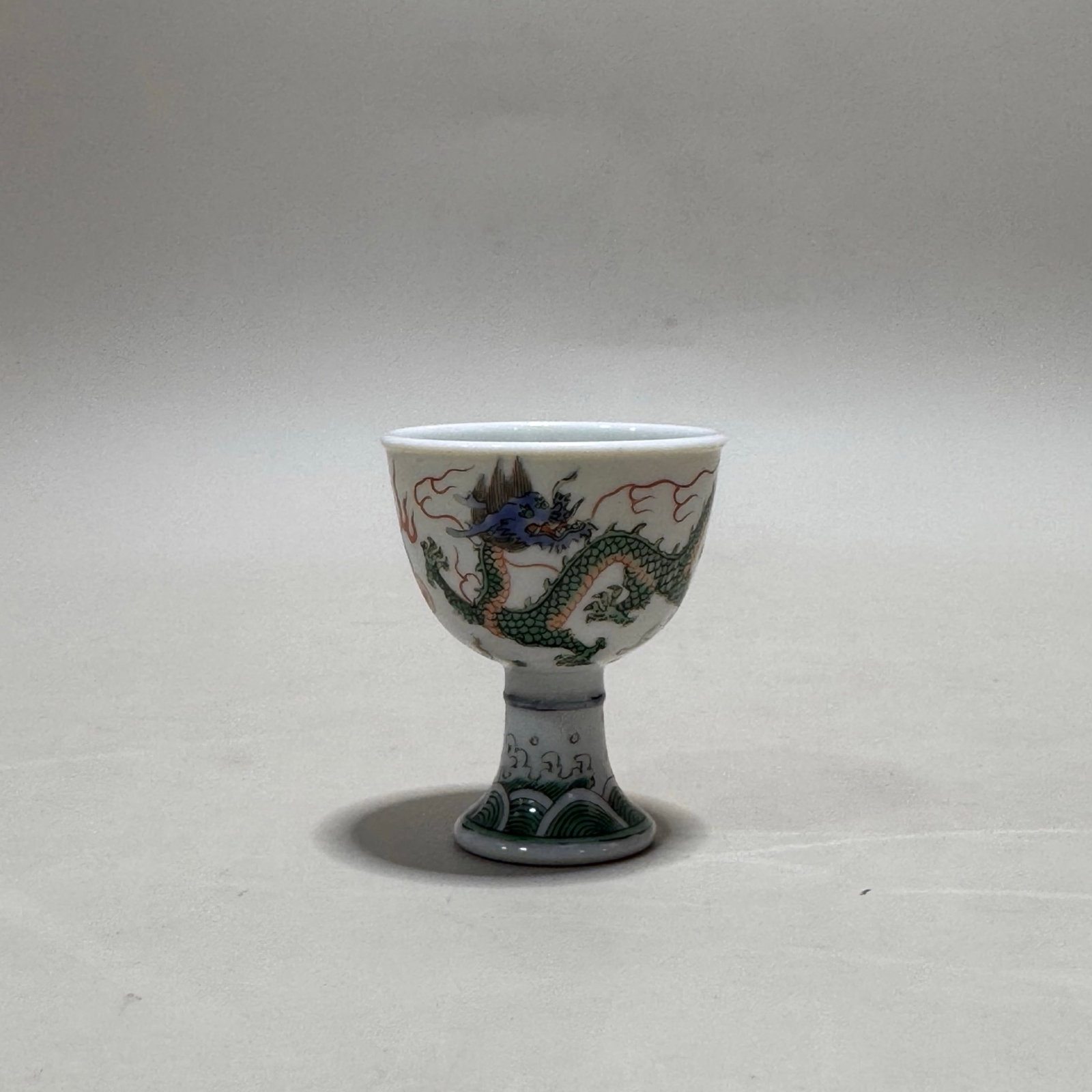 An Exquisite Famille-Rose Auspicious Cloud and Dragon Pattern Stem Cup: An Exquisite Famille-Rose Auspicious Cloud and Dragon Pattern Stem Cup,Qing Dynasty,China,Yongzheng Six-character Mark,Size:1.9inx1.6in 粉彩祥云龙纹高足