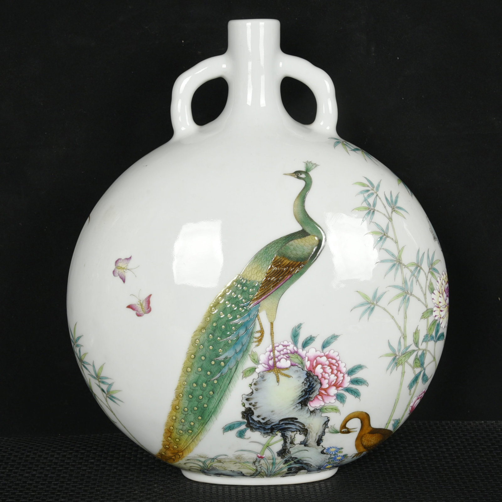 A Rare Enamel Flower and Peacock Pattern Double-Ears Vase,with poem: A Rare Enamel Flower and Peacock Pattern Double-Ears Vase,with poem,Qing Dynasty,China,Qianlong Six-character Mark,Size:11.8inx9.8inx4.7in 珐琅彩花卉孔雀ń