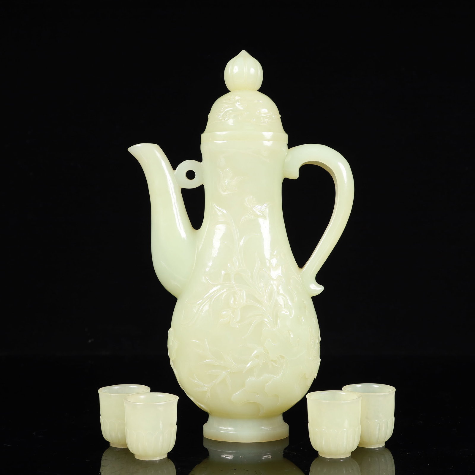 A Set of Fine White Jade Flower and Bird Pattern Teaware: A Set of Fine White Jade Flower and Bird Pattern Teaware,Qing Dynasty, China,Size:(执壶)5.5inx1.6inx9.4in,(杯)1.2inx1.3in,Weight:600g 一套白玉花鸟