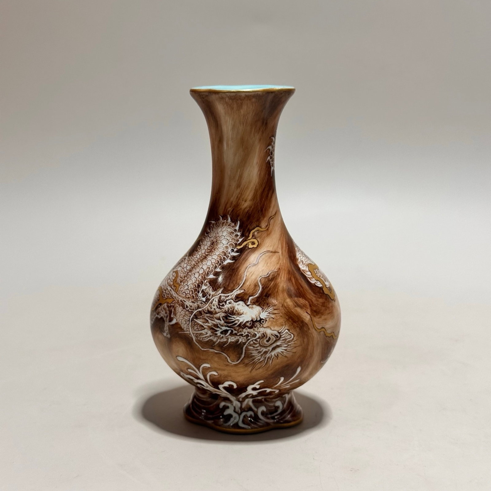 An Exquisite Imitation Wood Grain Glazed Ink Color Auspicious Cloud and Dragon Pattern Vase: An Exquisite Imitation Wood Grain Glazed Ink Color Auspicious Cloud and Dragon Pattern Vase,Qing Dynasty,China,Qianlong Four-character Mark,Size:4.2inx2.4in 木纹釉墨彩