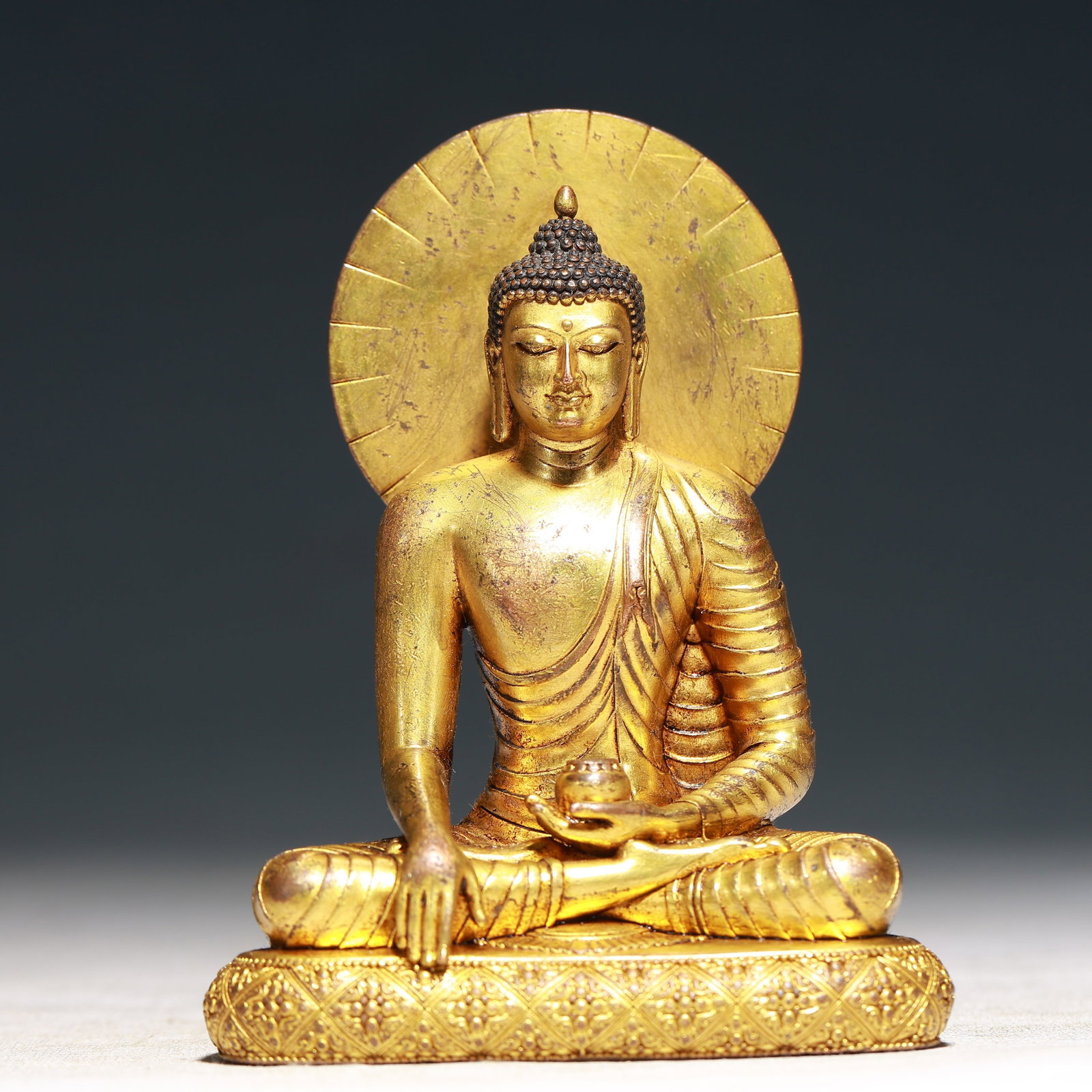 A Solemn Gilt Bronze Statue of Sakyamuni: A Solemn Gilt Bronze Statue of Sakyamuni,Qing Dynasty,China,Size:3.5inx2.4inx4.7in,Weight:500g 铜鎏金释迦摩尼像,中国清代
