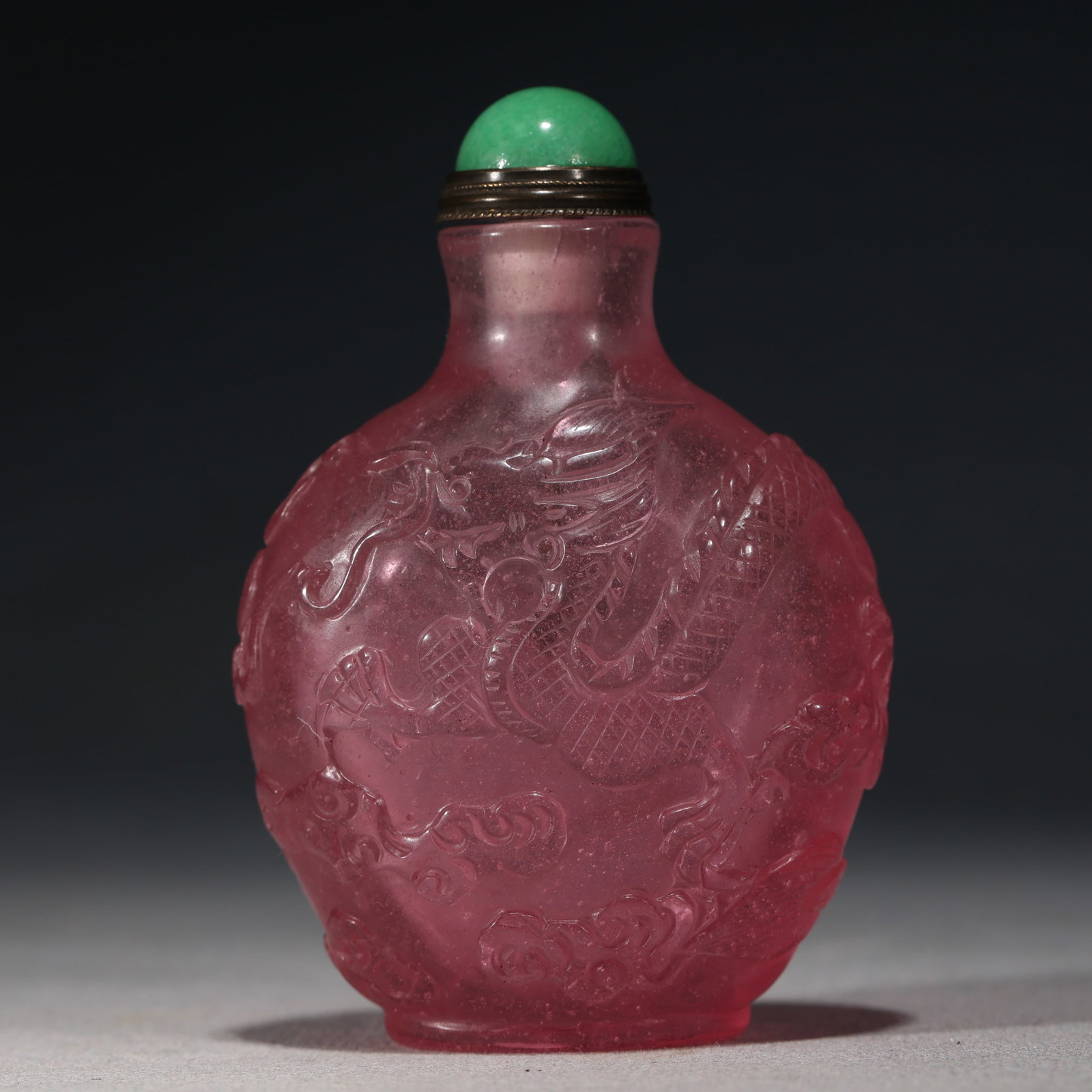 An Exquisite Pink Glass Cloud Dragon Pattern Snuff Bottle: An Exquisite Pink Glass Cloud Dragon Pattern Snuff Bottle,Qing Dynasty, China,Qianlong Four-character Mark,Size:2.4in×1.2in×3.1in 粉色琉璃云龙纹(
