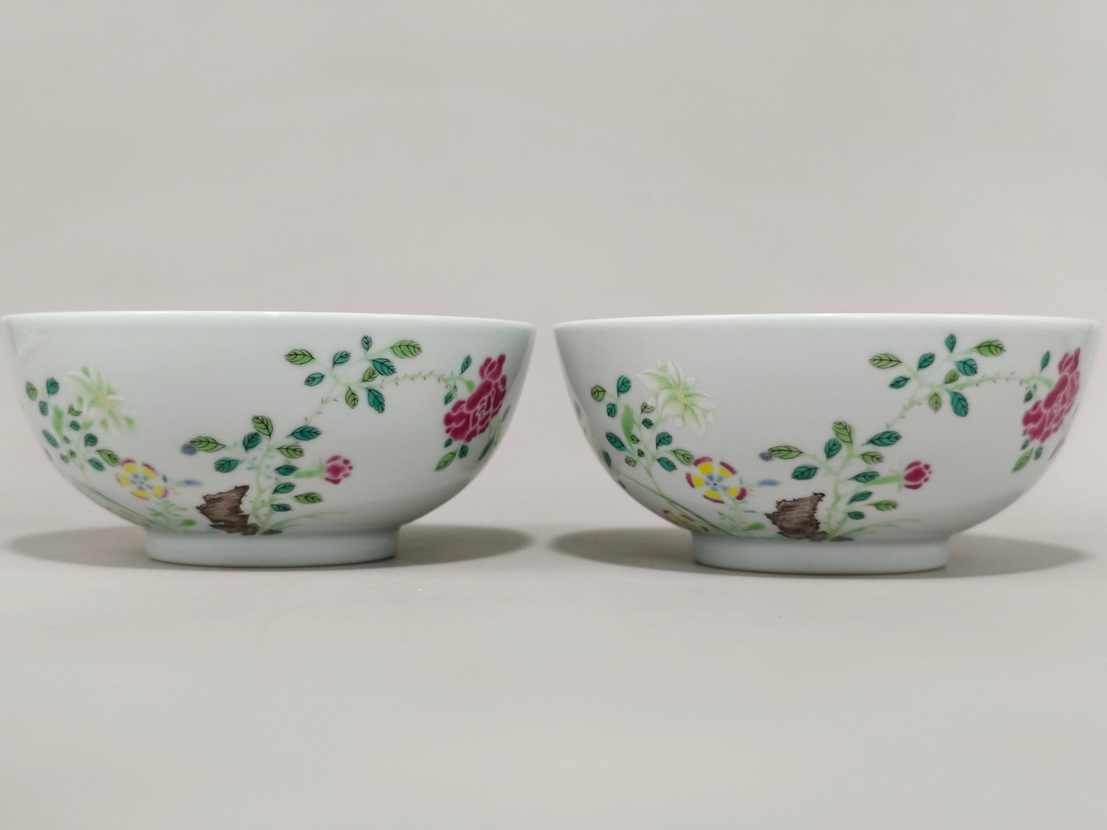 A Pair of Exquisite Famille-Rose Flower and Butterfly Pattern Bowls: A Pair of Exquisite Famille-Rose Flower and Butterfly Pattern Bowls,Qing Dynasty,China,Yongzheng Six-character Mark,Size:3.1inx6.9in 一对粉彩花卉蝴蝶