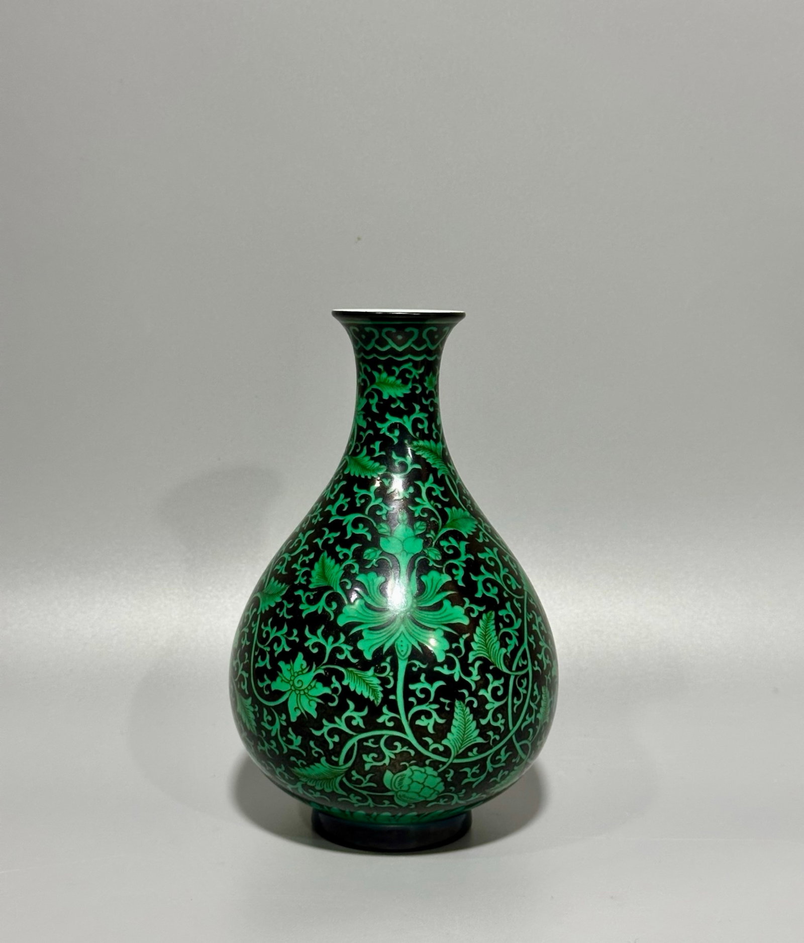 An Exquisite Black Ground Green Glazed Lotus Pattern Vase: An Exquisite Black Ground Green Glazed Lotus Pattern Vase,Qing Dynasty,China,Yongzheng Six-character Mark,Size:6.7inx4.4in 黑地绿釉缠枝莲纹瓶,