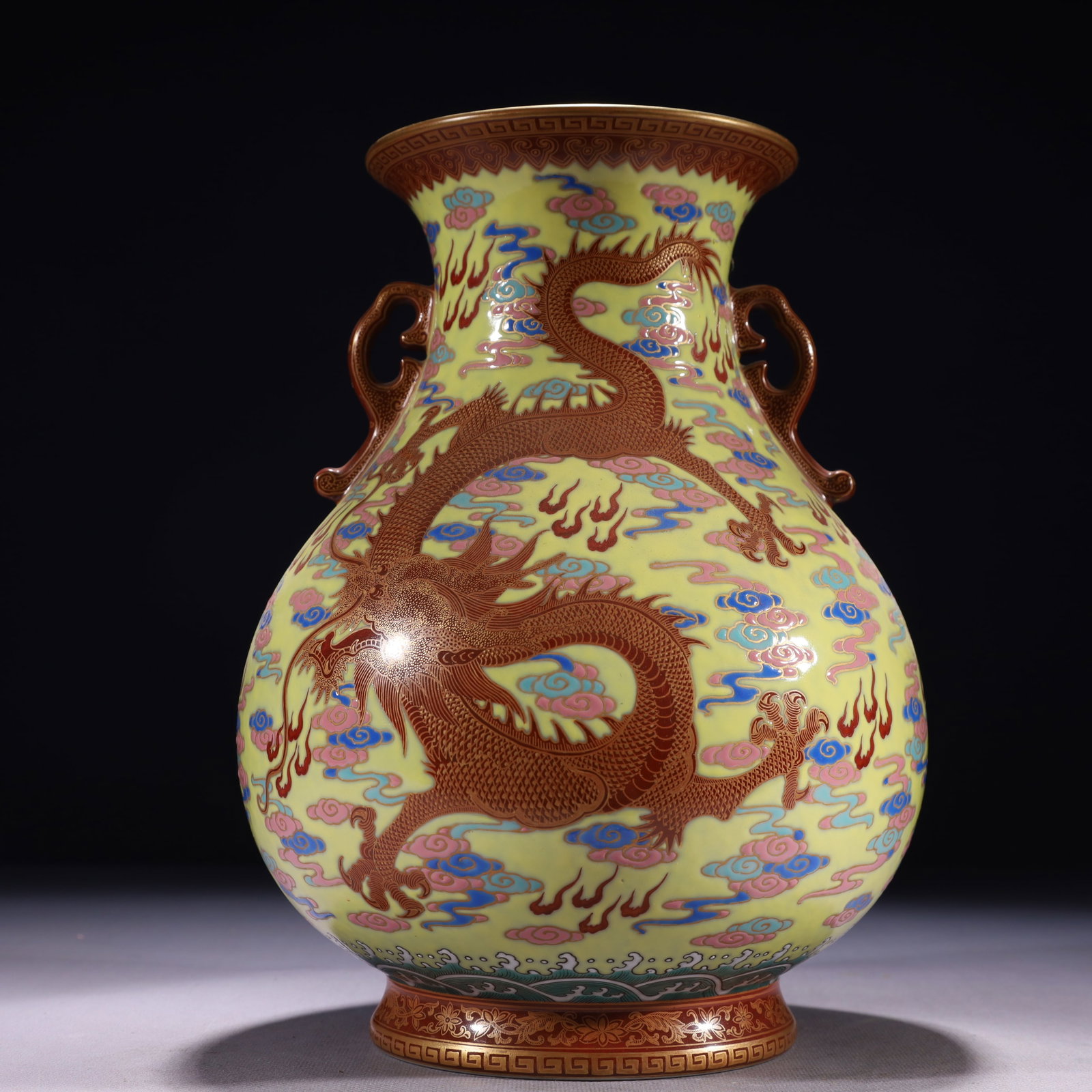 An Exquisite Yellow Ground Famille-Rose Painted Gold Auspicious Cloud and Dragon Pattern Double-Ears: An Exquisite Yellow Ground Famille-Rose Painted Gold Auspicious Cloud and Dragon Pattern Double-Ears Vase,Qing Dynasty,China,Yongzheng Six-character Mark,Size:7.1inx10.6in,Weight:2300g 黄地