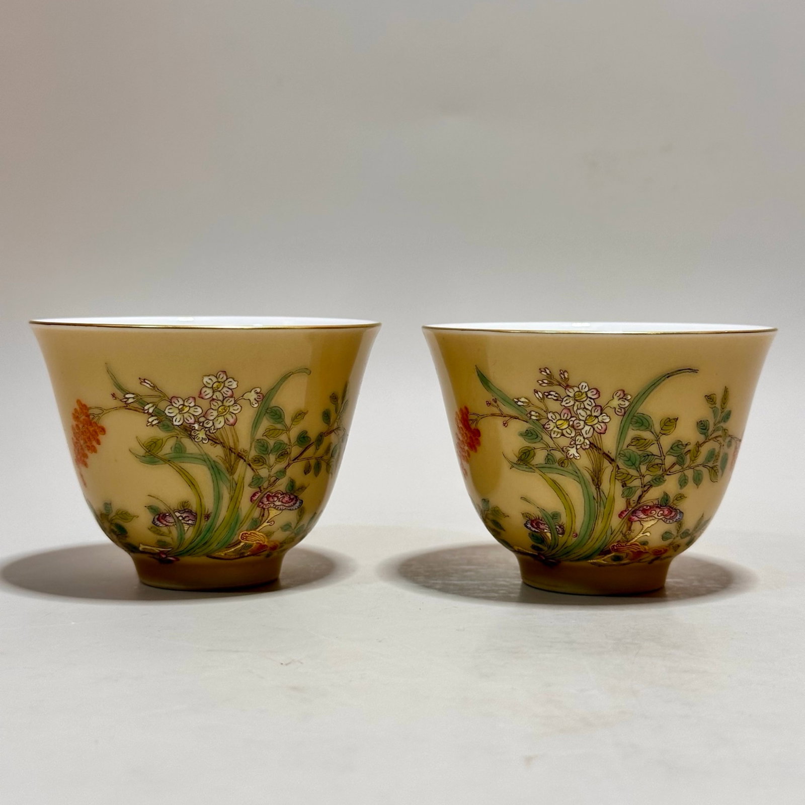 A Pair of Exquisite Yellow Ground Famille-Rose Flower Pattern Cups,with poem: A Pair of Exquisite Yellow Ground Famille-Rose Flower Pattern Cups,with poem,Qing Dynasty,China,Qianlong Four-character Mark,Size:2.3inx3.1in 一对黄地粉彩花&#