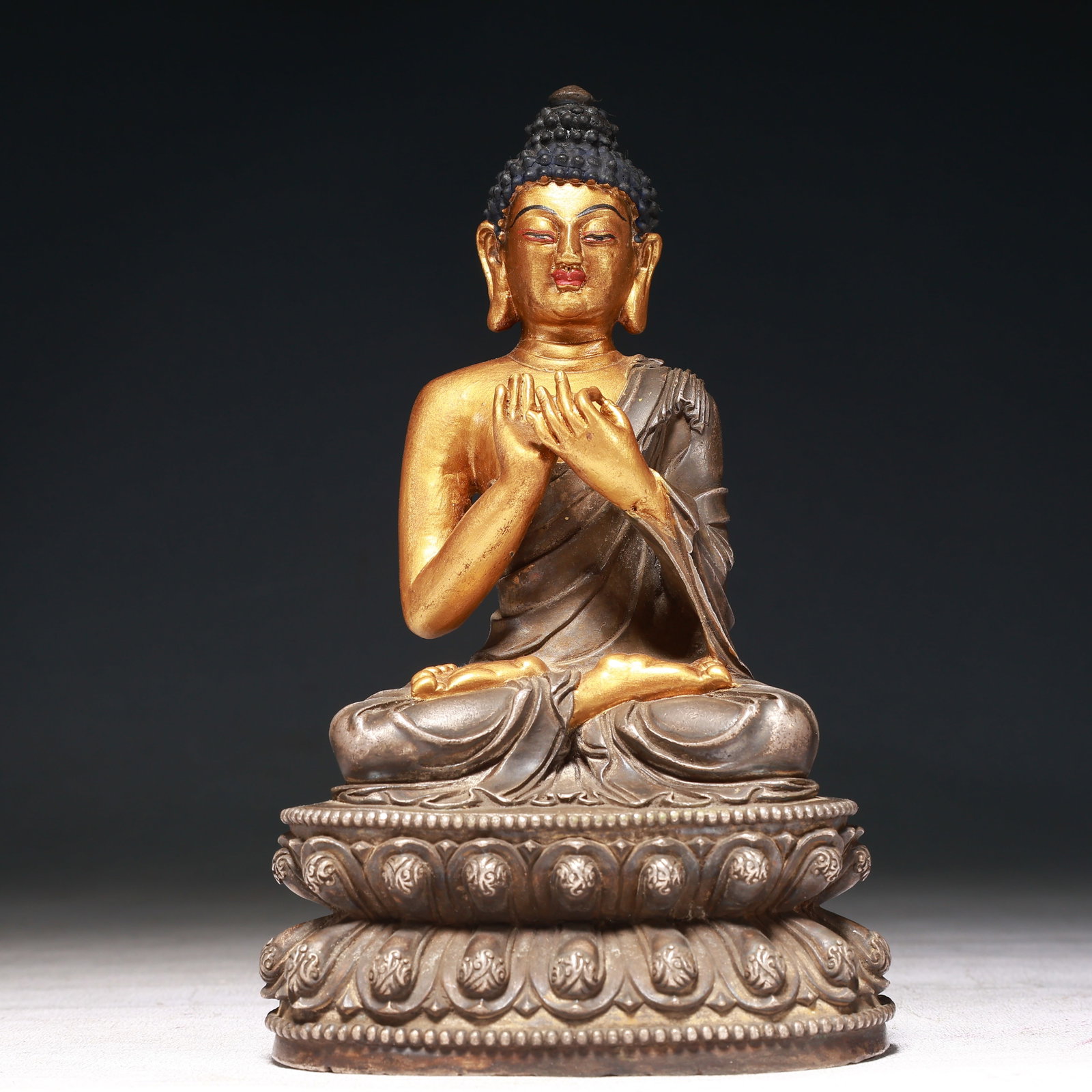 A Solemn Gilt Bronze Statue of Sakyamuni: A Solemn Gilt Bronze Statue of Sakyamuni,Qing Dynasty,China,Size:4.3inx2.8inx7.1in,Weight:1150g 铜鎏金释迦摩尼像,中国清代