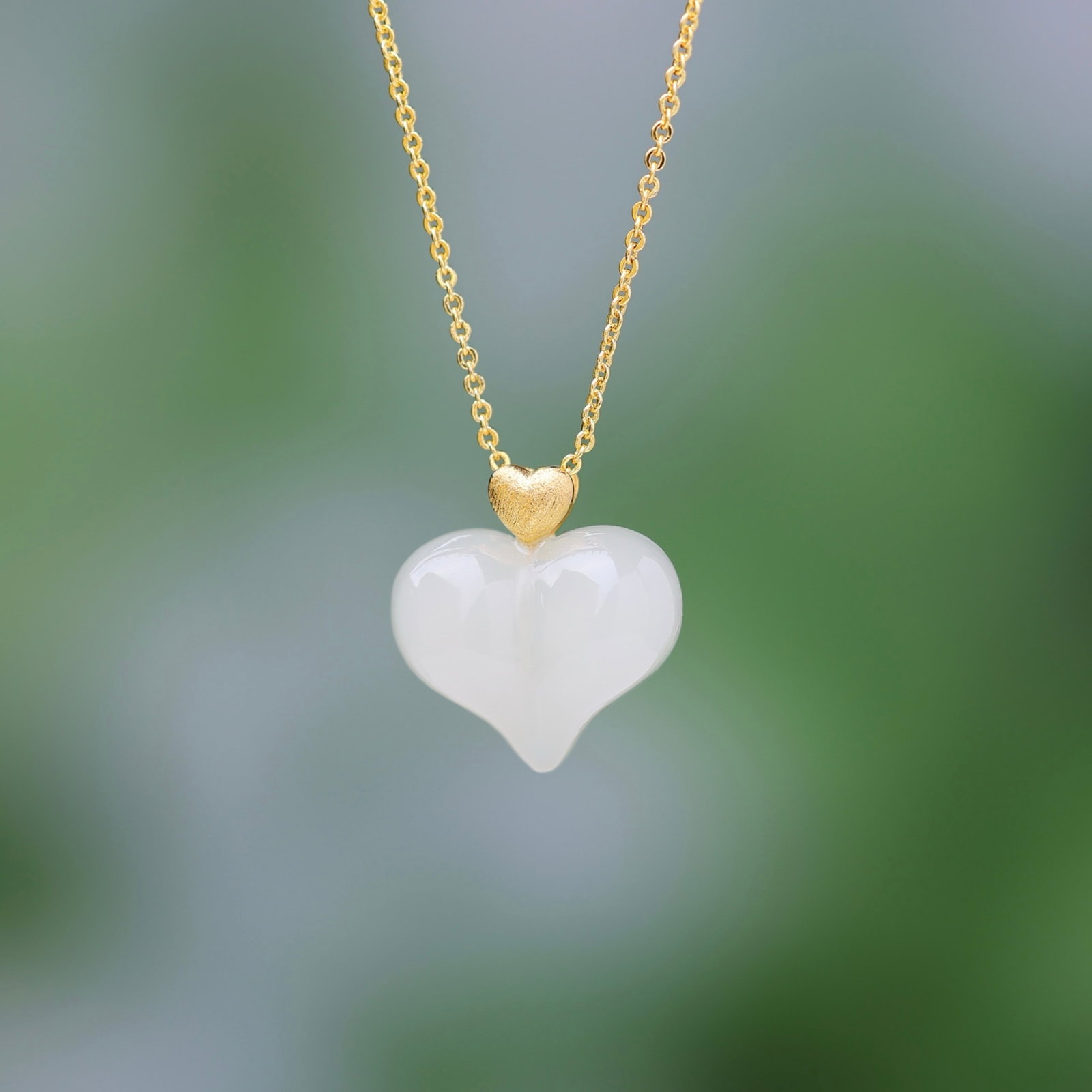 An Exquisite Sterling Silver-Gold Plated Inlaid White Jade Pendant: An Exquisite Sterling Silver-Gold Plated Inlaid White Jade Pendant,Size:15mmx18mm 纯银镀金镶白玉吊坠