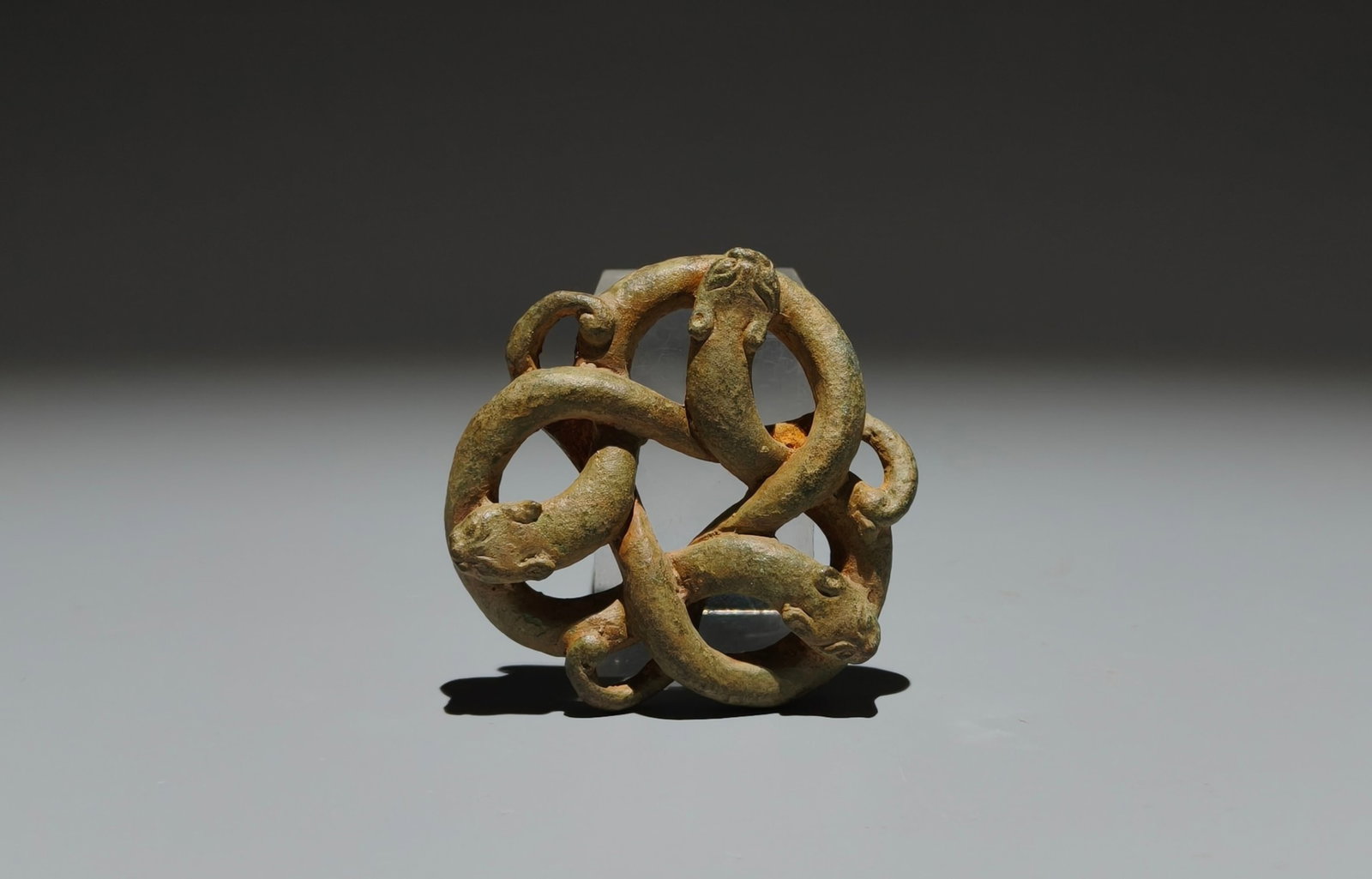 An Archaic Bronze Hollow Coiled-Dragon Pattern Pendant: An Archaic Bronze Hollow Coiled-Dragon Pattern Pendant,the Warring States period in China,Size:2.4in 青铜镂空蟠龙纹挂件,中国战&#