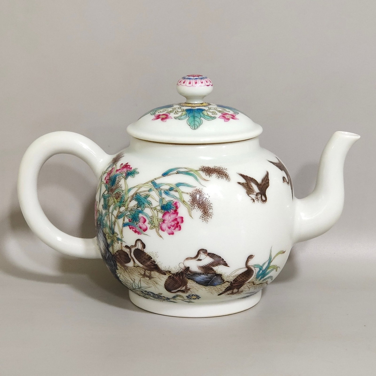 An Exquisite Enamel Flower and Bird Pattern Teapot,with poem: An Exquisite Enamel Flower and Bird Pattern Teapot,with poem,Qing Dynasty,China,Qianlong Four-character Mark,Size:4.7inx6.7in 珐琅彩花鸟纹茶壶,带&
