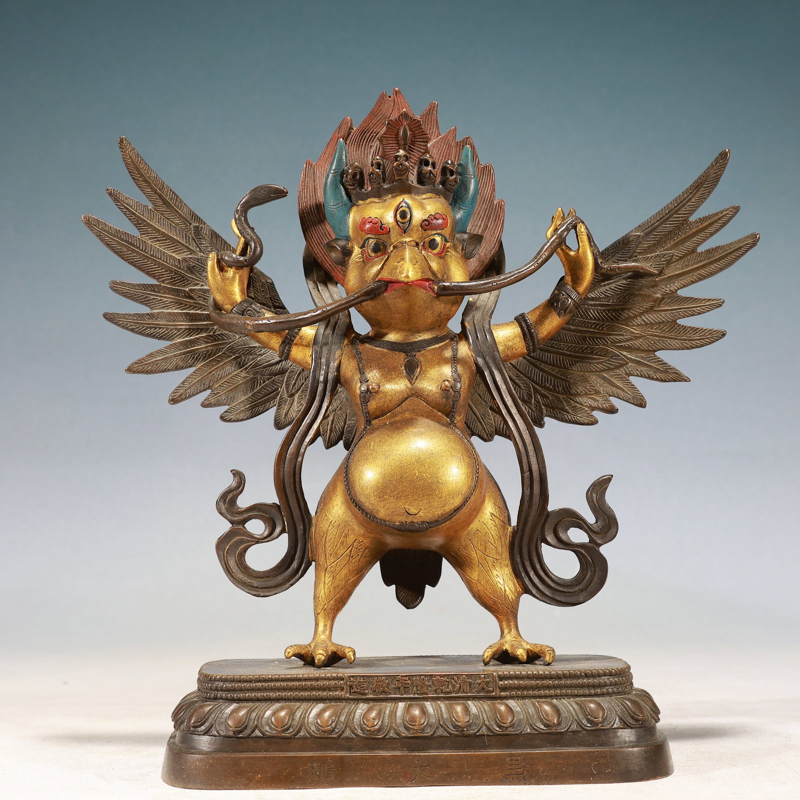 A Solemn Gilt Bronze Statue of Garu?a: A Solemn Gilt Bronze Statue of Garuḍa,Qing Dynasty, China,Qianlong Mark,Size:9.4inx3.5inx10.2in,Weight:2850g 铜鎏金大鹏金翅鸟像,中
