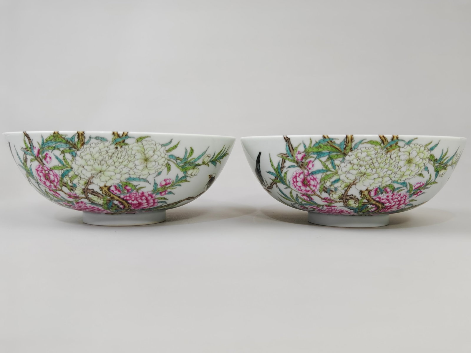 A Pair of Exquisite Famille-Rose Flower and Bird Pattern Bowls: A Pair of Exquisite Famille-Rose Flower and Bird Pattern Bowls,Qing Dynasty,China,Yongzheng Six-character Mark,Size:2.6inx6.6in 一对粉彩花鸟纹碗,中