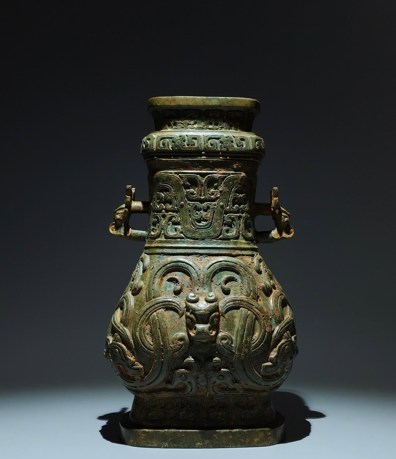 An Archaic Bronze Chi-Dragon Pattern Beast-Ears Pot,With Inscription: An Archaic Bronze Chi-Dragon Pattern Beast-Ears Pot,With Inscription,W.Zhou,China,Size:15.6inx8.7inx7.1in