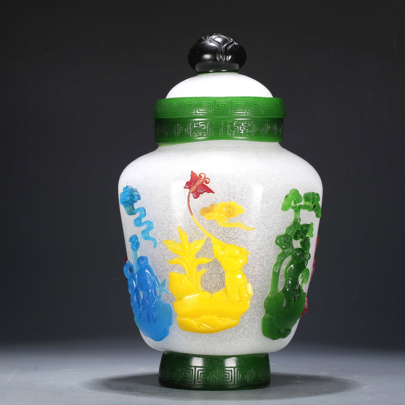 A Multi-Color Overlay White Glass 'Figure' Jar And Cover: A Multi-Color Overlay White Glass 'Figure' Jar And Cover. The top is painted with a key-fret border, body with figures. Chinese Qing Dynasty. Qianlong Four-Character Mark. Size:4.7inx8.7in 清