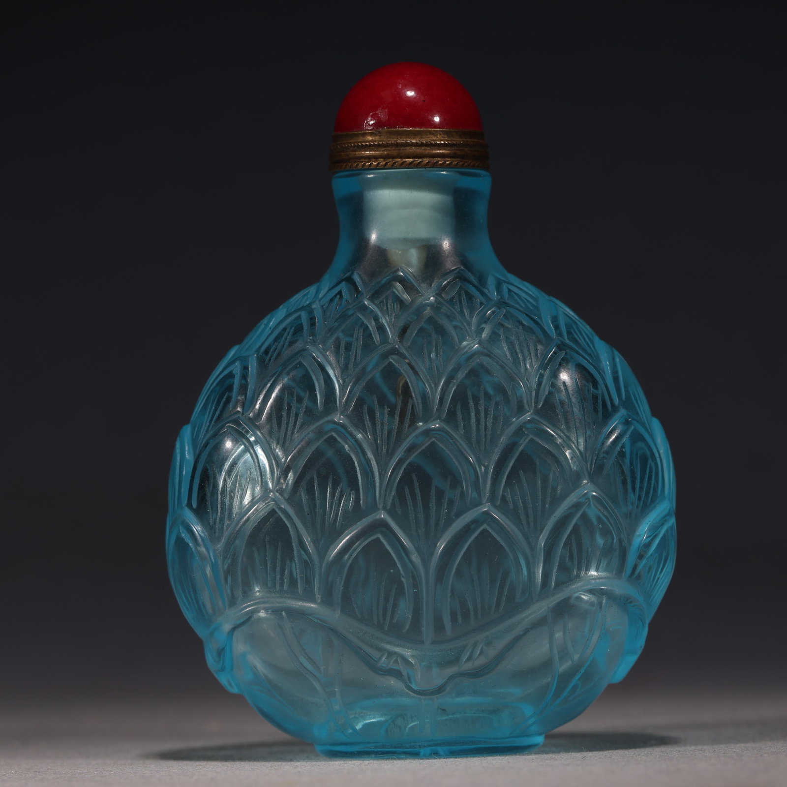 An Exquisite Sky-blue Glass Relief Lotus Petal Pattern Snuff Bottle: An Exquisite Sky-blue Glass Relief Lotus Petal Pattern Snuff Bottle,Qing Dynasty, China,Size:2.4in×1.2in×3.1in 天蓝琉璃浮雕莲瓣纹鼻