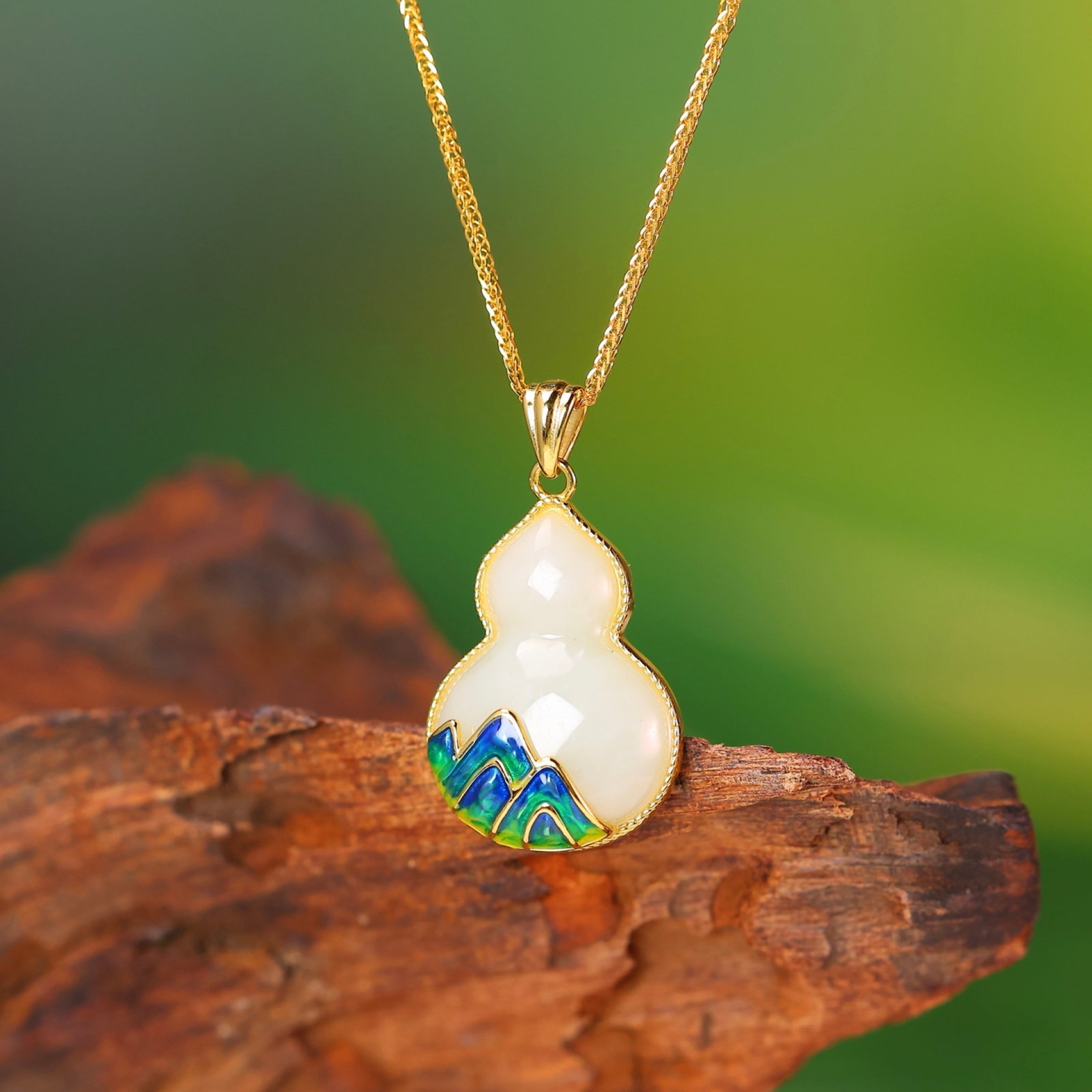 An Exquisite Sterling Silver-Gold Plated Inlaid White Jade Enamel Gourd Pendant: An Exquisite Sterling Silver-Gold Plated Inlaid White Jade Enamel Gourd Pendant,Size:15mmx21mm 纯银镀金镶白玉珐琅葫芦吊坠