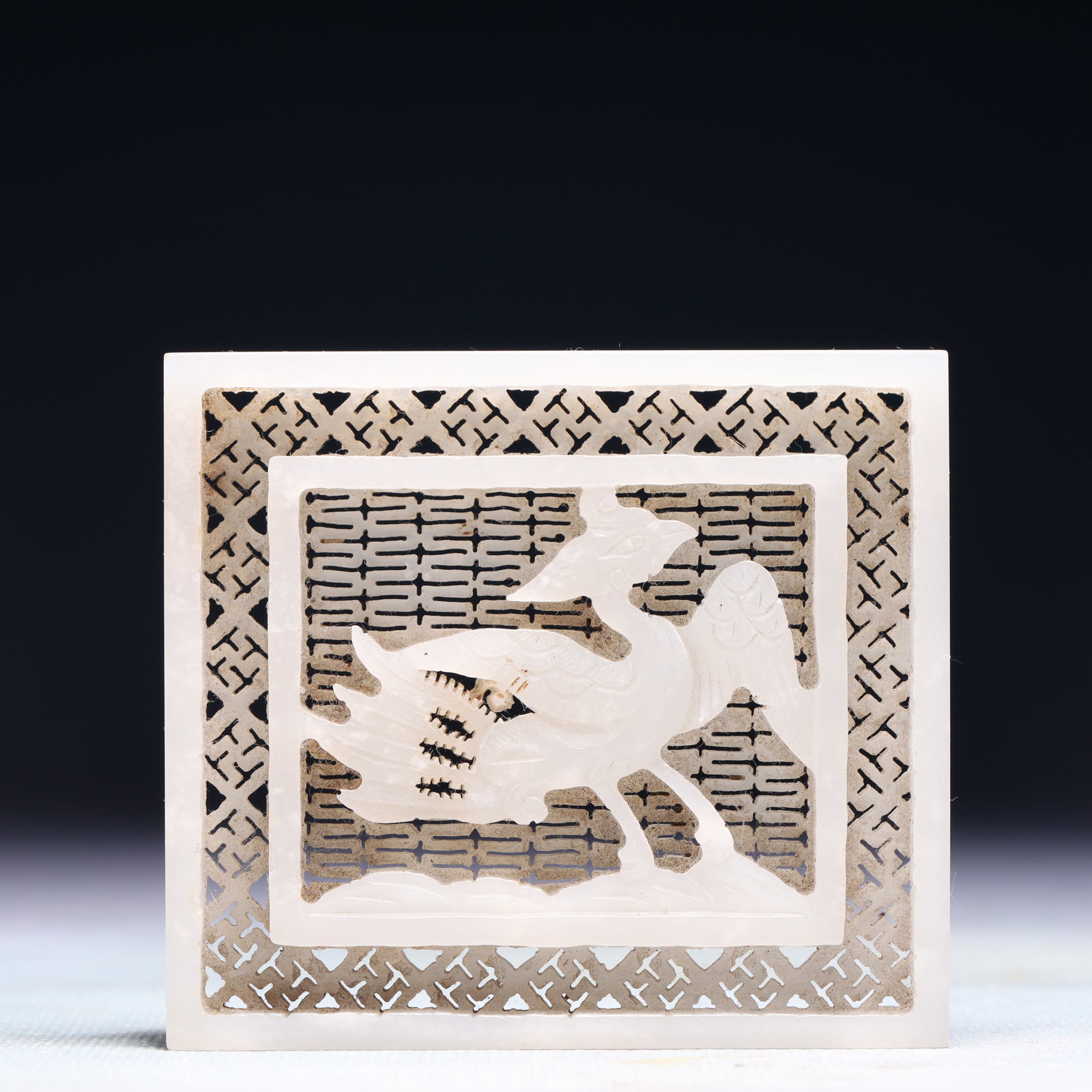 An Exquisite White Jade Phoenix Pattern Pendant: An Exquisite White Jade Phoenix Pattern Pendant,Qing Dynasty,China,Size:3.1inx2.8in,Weight:72.9g 白玉凤纹佩,中国清代