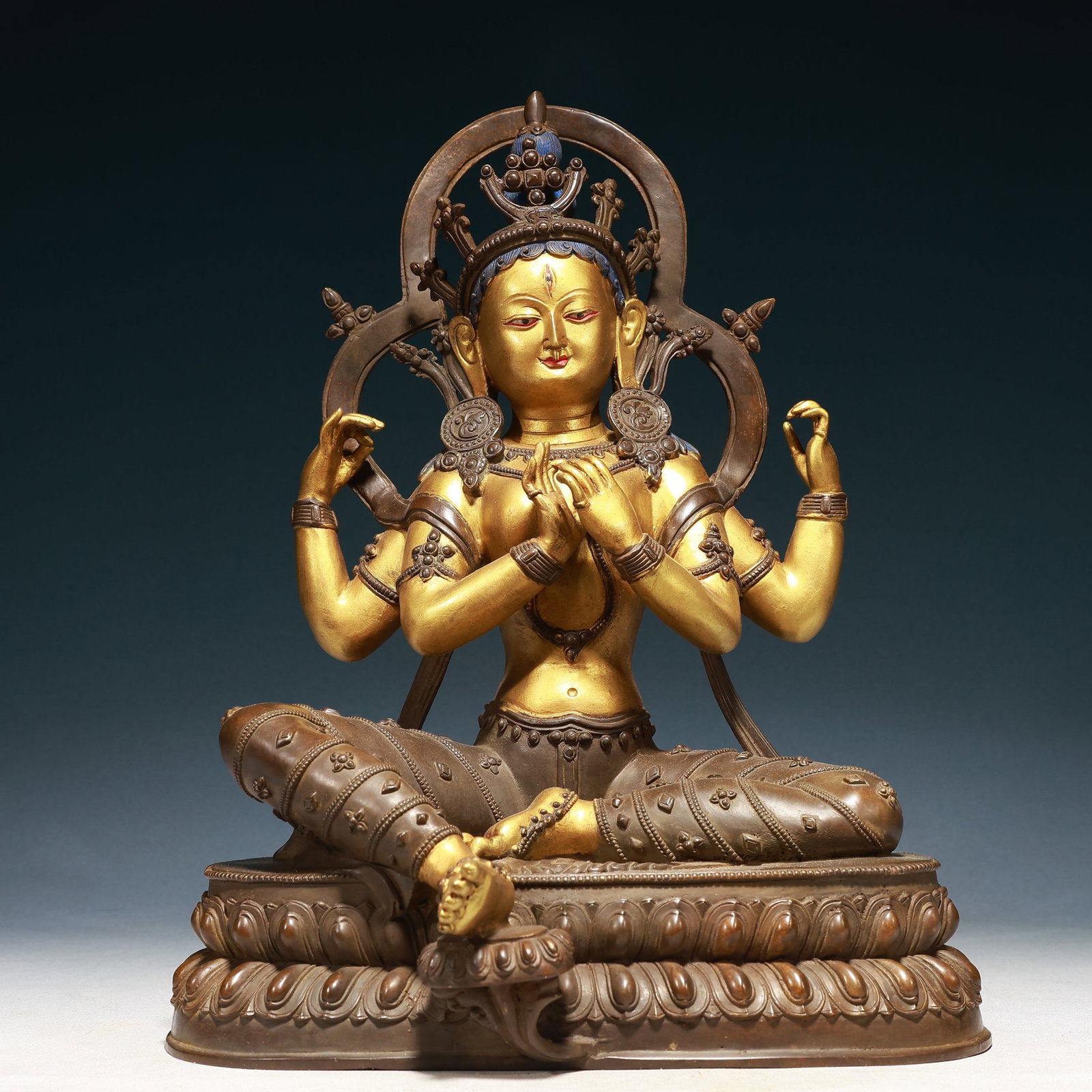 A Solemn Gilt Bronze Four-arms Statue of Avalokitesvara: A Solemn Gilt Bronze Four-arms Statue of Avalokitesvara,Qing Dynasty,China,Size:11inx6.7inx17.3in,Weight:7300g
