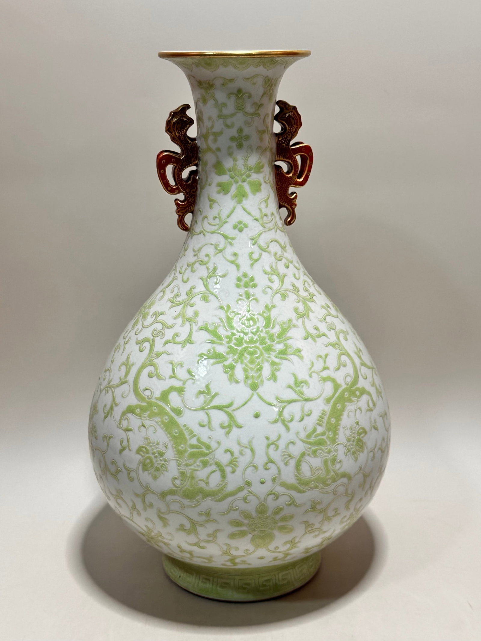 A Rare Green Glazed Painted Gold Lotus Pattern Double-Ears Vase: A Rare Green Glazed Painted Gold Lotus Pattern Double-Ears Vase,Qing Dynasty,China,Qianlong Six-character Mark,Size:12.2inx7.1in