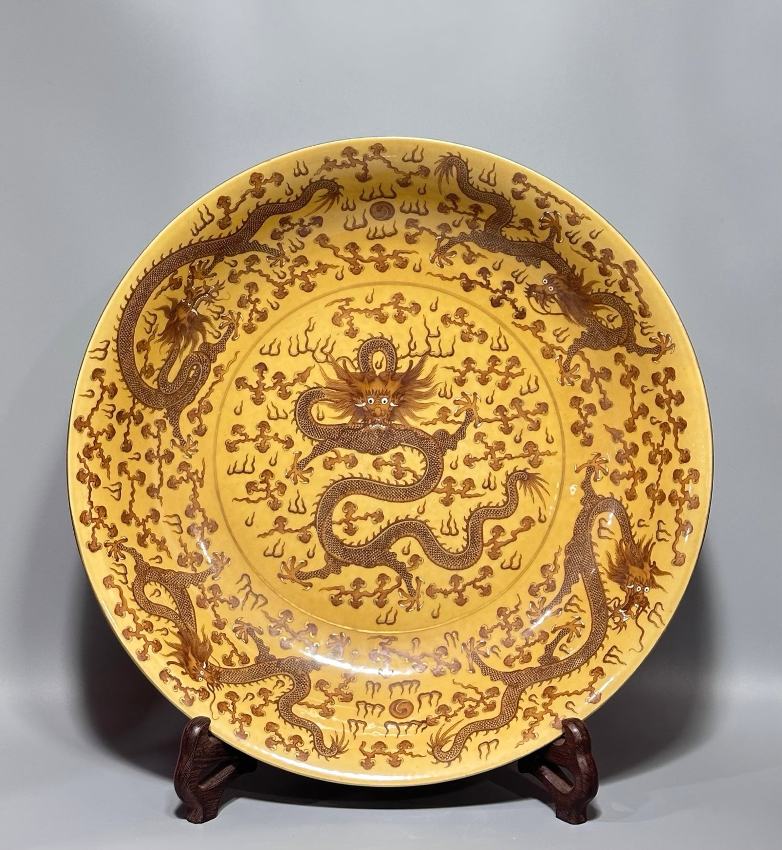An Exquisite Yellow Ground Iron-Red Auspicious Cloud and Dragon Pattern Plate: An Exquisite Yellow Ground Iron-Red Auspicious Cloud and Dragon Pattern Plate,Qing Dynasty,China,Qianlong Six-character Mark,Size:4.3inx20.1in 黄地矾红祥云龙&
