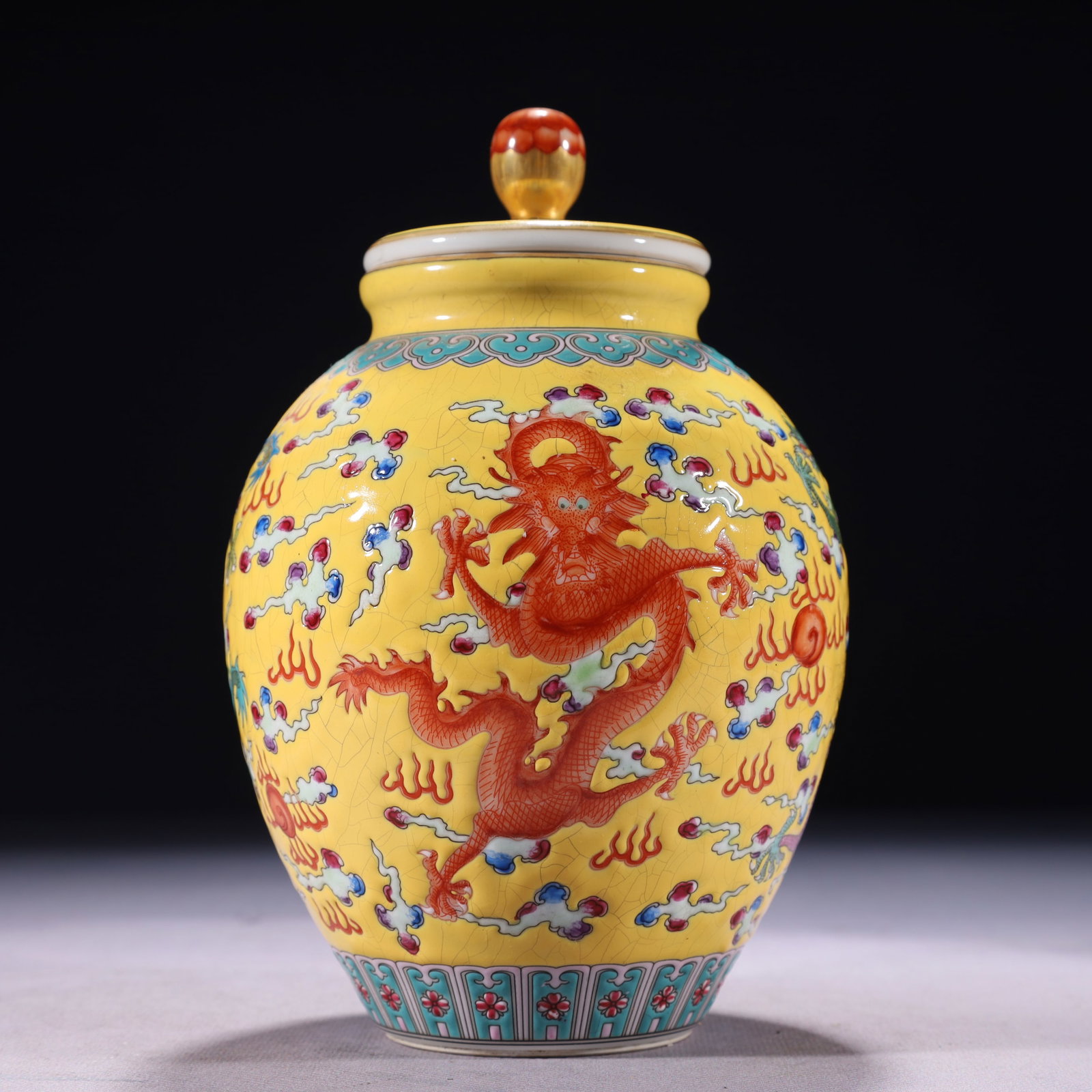 An Exquisite Yellow Ground Famille-Rose Auspicious Cloud and Dragon Pattern Tea Caddy: An Exquisite Yellow Ground Famille-Rose Auspicious Cloud and Dragon Pattern Tea Caddy,Qing Dynasty,China,Qianlong Four-character Mark,Size:4.3inx8.3in,Weight:600g 黄地粉彩Ķ