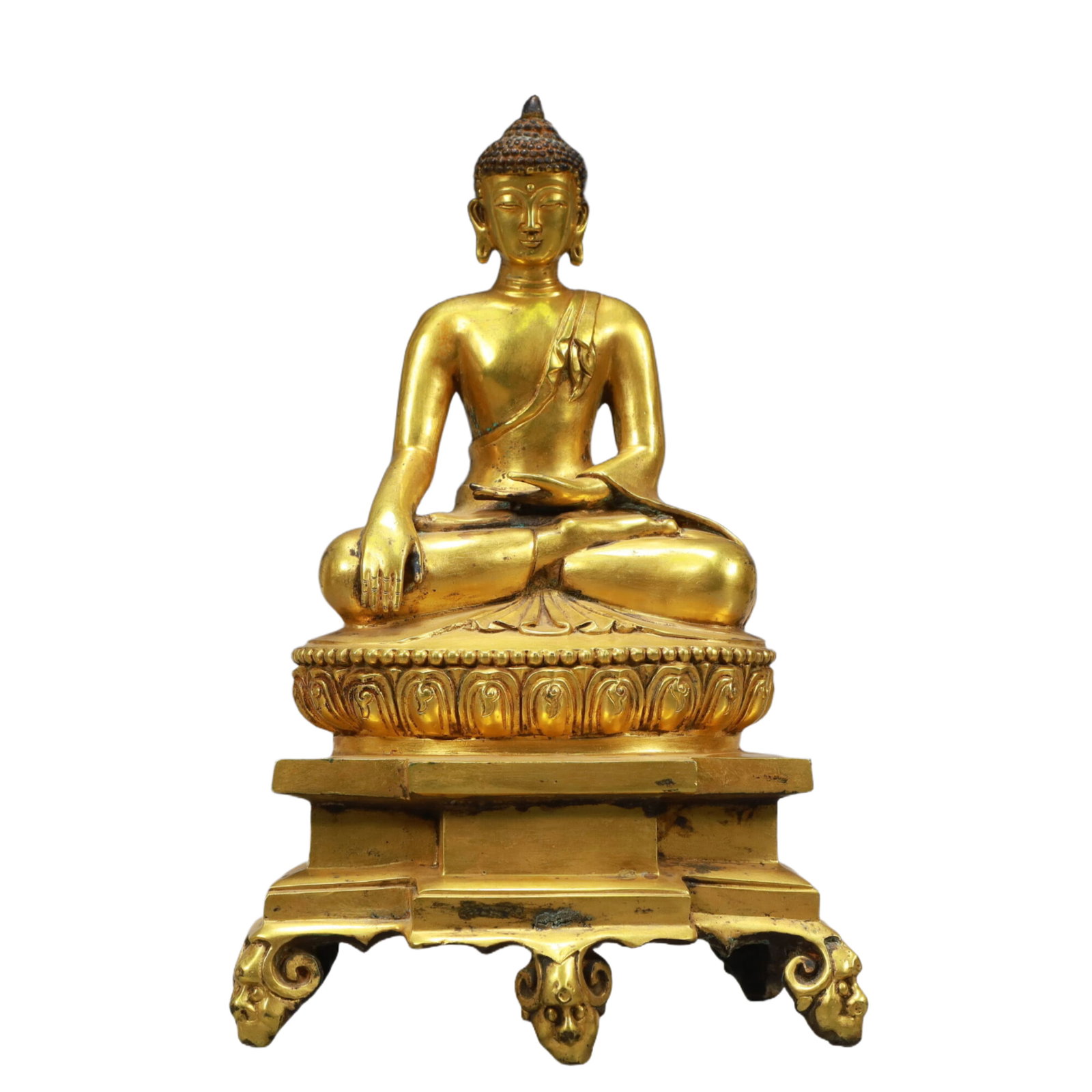 An Excellent Gilt-Bronze Figure Of Buddha Shakyamuni: An Excellent Gilt-Bronze Figure Of Buddha Shakyamuni. Superbly and sensitively sculpted in the form of a seated Buddha Shakyamuni,with well-defined arched eyebrows juxtaposed with the prominent nose a
