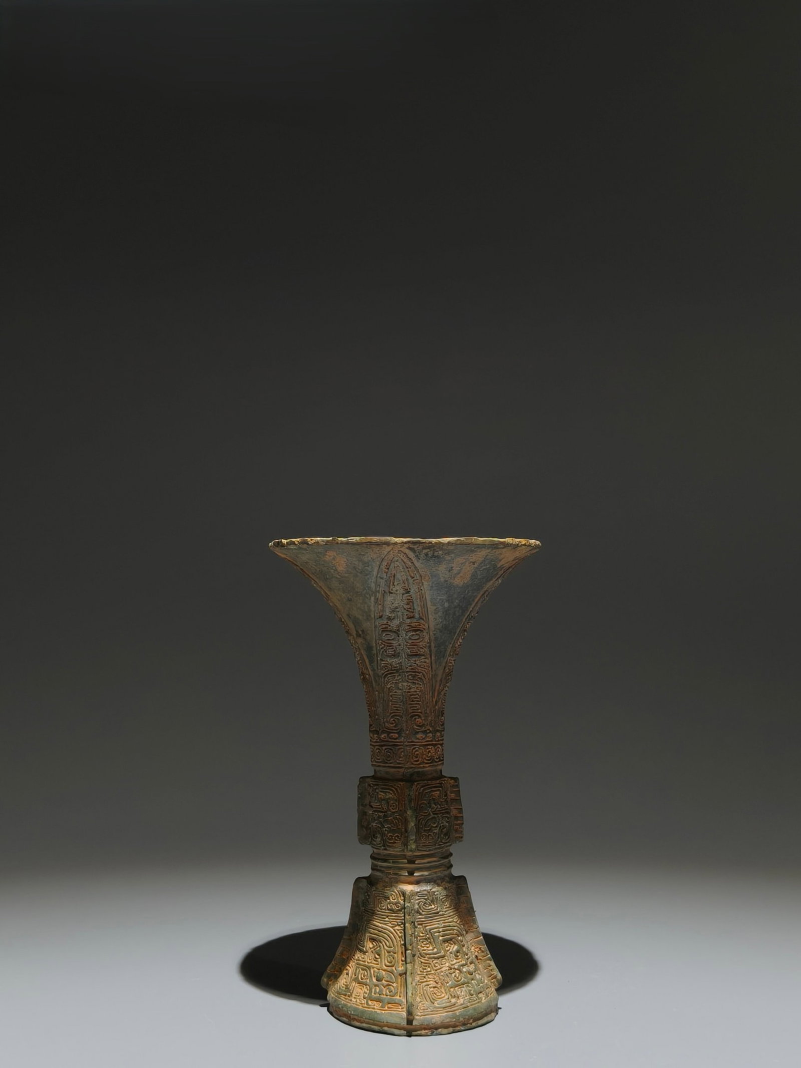 An Archaic Bronze Beast-Face Pattern Gu: An Archaic Bronze Beast-Face Pattern Gu,Shang Dynasty,China,Size:6.1inx3.5in 青铜兽面纹觚,中国商代