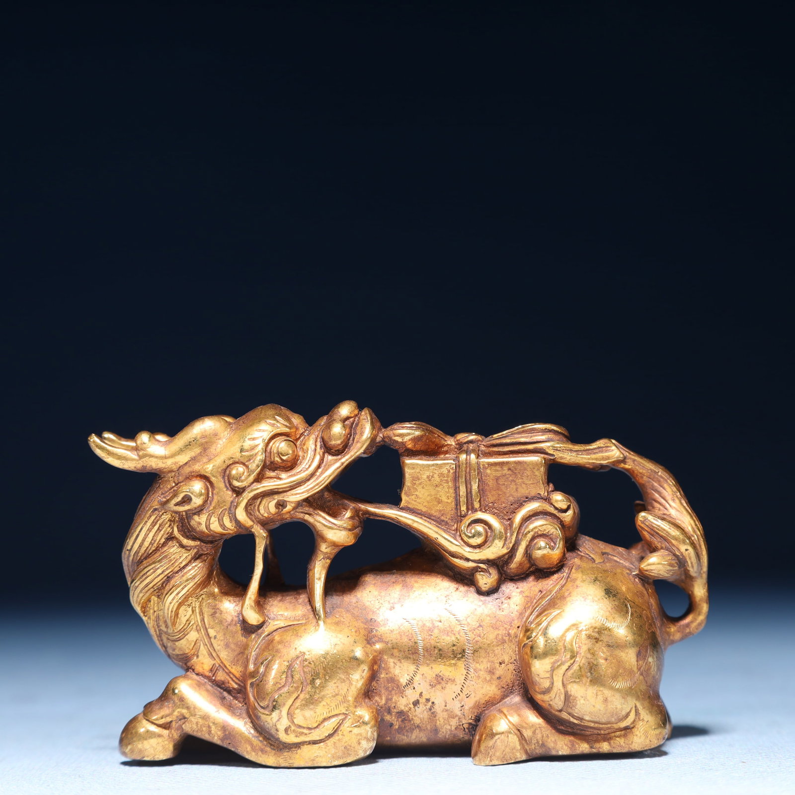 An Exquisite Gilt Bronze Kylin Ornament: An Exquisite Gilt Bronze Kylin Ornament,Qing Dynasty,China,Size:3.1inx1.4inx2in,Weight:550g 铜鎏金麒麟摆件,中国清代