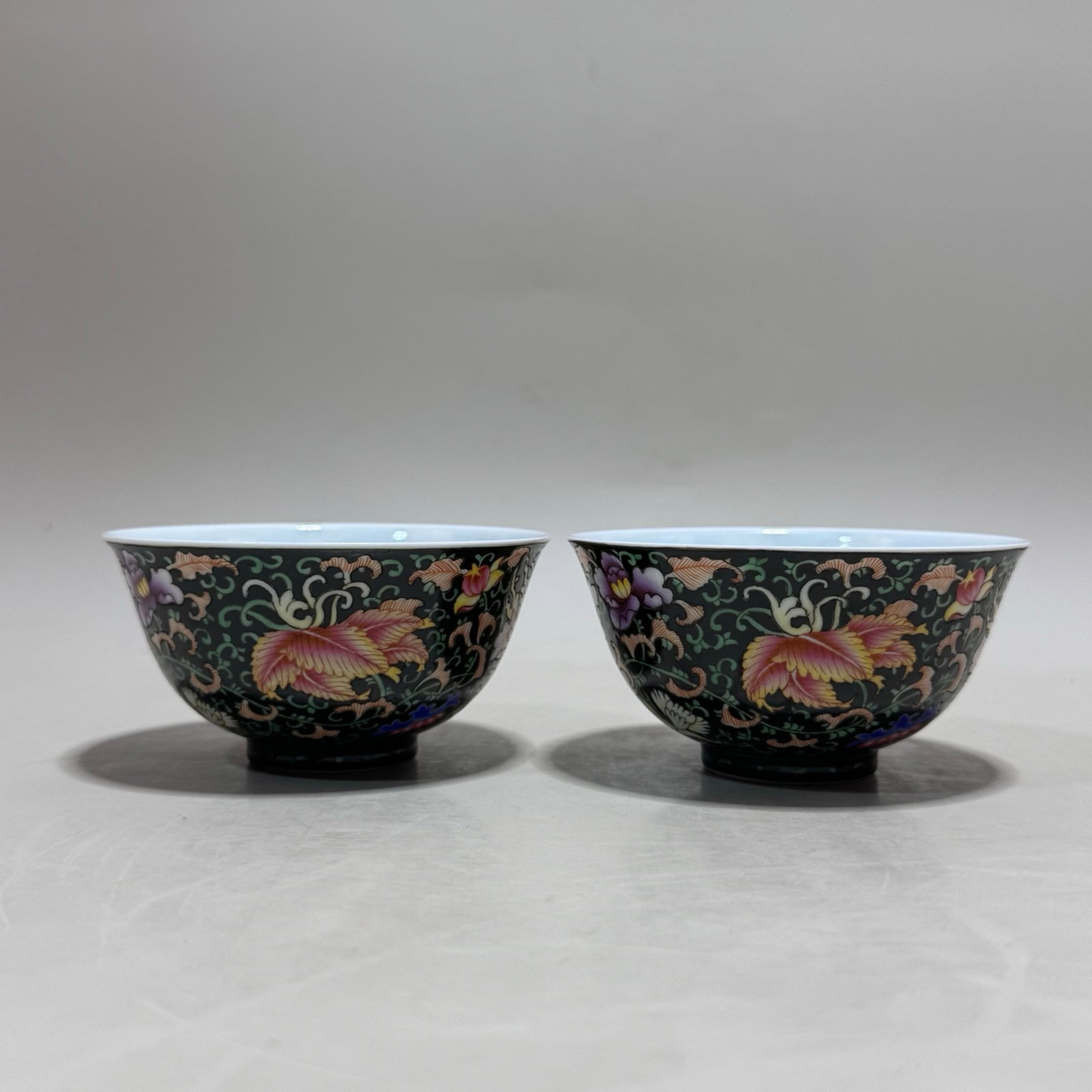 A Pair of Exquisite Black Ground Famille-Rose Lotus Pattern Bowls: A Pair of Exquisite Black Ground Famille-Rose Lotus Pattern Bowls,Qing Dynasty,China,Yongzheng Four-character Mark,Size:1.9inx3.7in 一对黑地粉彩缠枝!