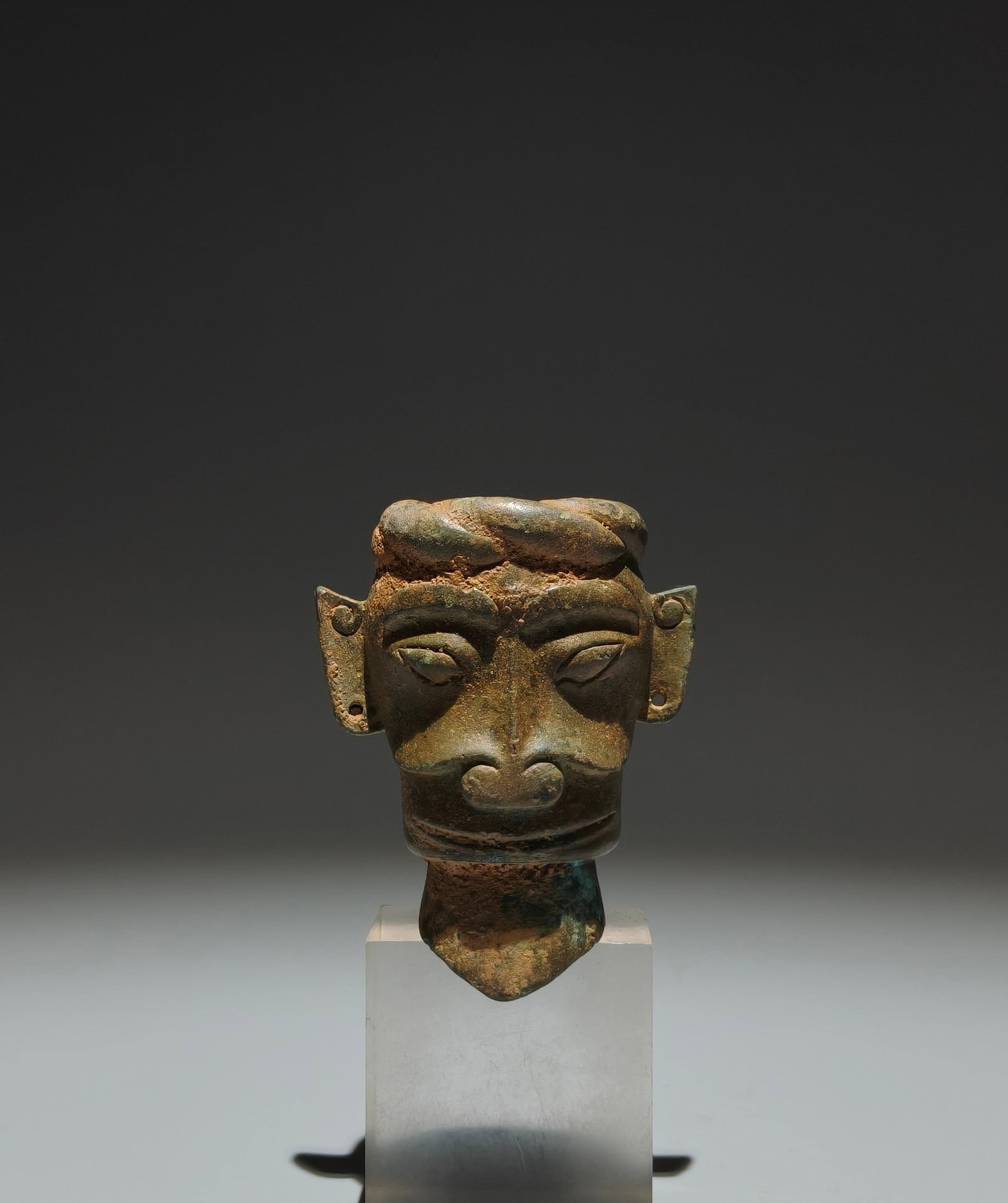 An Archaic Bronze Figure-Face Pattern Ornament: An Archaic Bronze Figure-Face Pattern Ornament,Shang Dynasty,China,Size:3.3inx2.6inx1.8in 青铜人面纹摆件,中国商代