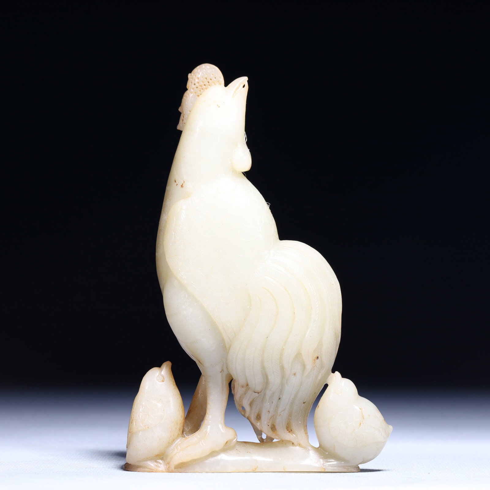 An Exquisite White Jade Rooster Ornament: An Exquisite White Jade Rooster Ornament,Qing Dynasty,China,Size:3.5inx0.8inx5.5in,Weight:358.5g 白玉公鸡摆件,中国清代