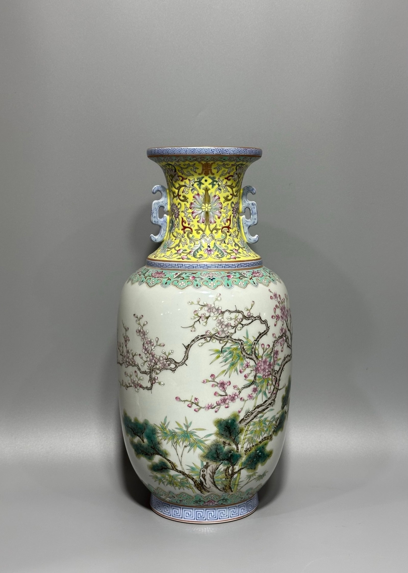 A Rare Enamel Painted Gold Pine,Bamboo and Plum Blossom Pattern Double-Ears Vase,with poem: A Rare Enamel Painted Gold Pine,Bamboo and Plum Blossom Pattern Double-Ears Vase,with poem,Qing Dynasty,China,Daoguang Six-character Mark,Size:12.9inx6.6in 珐琅彩描金