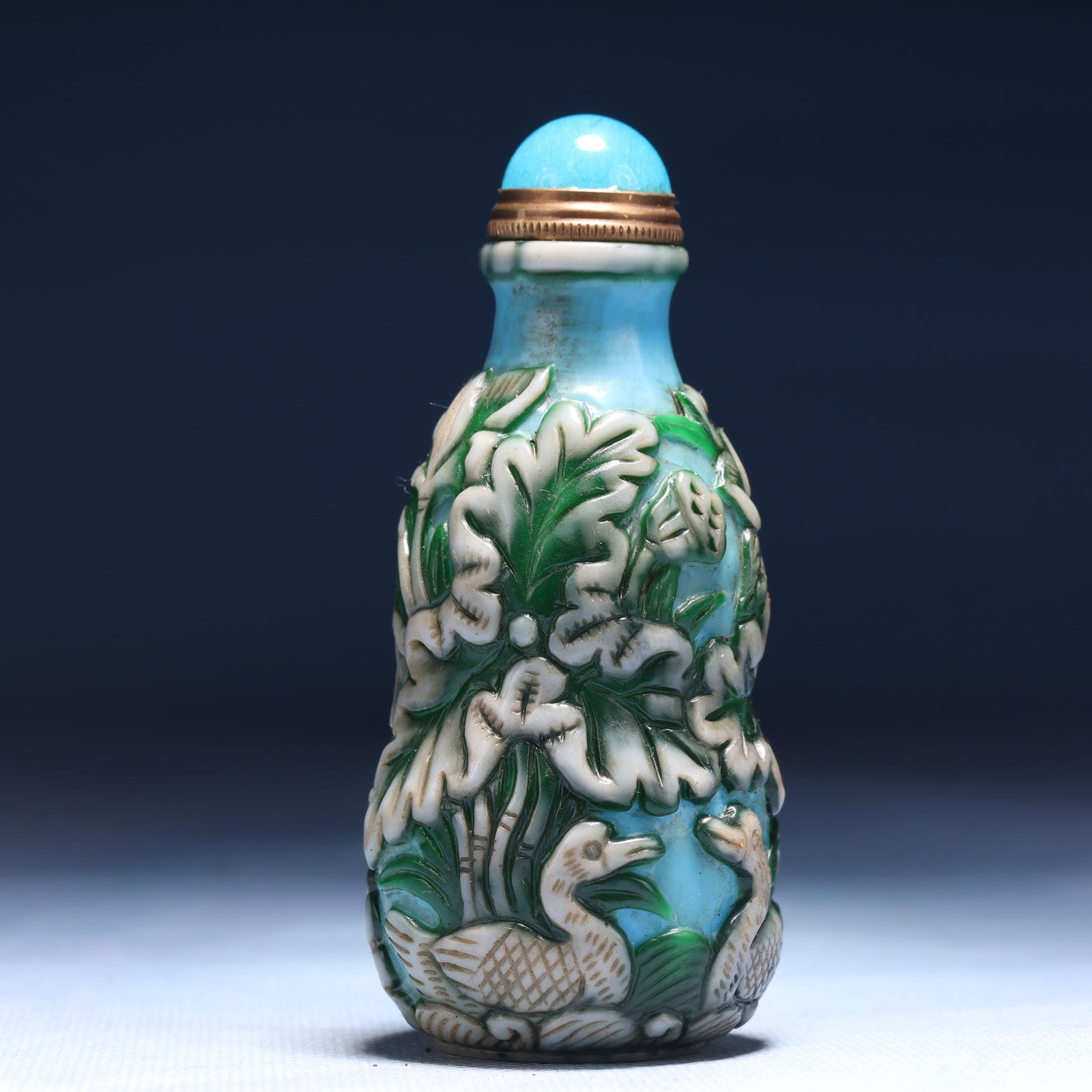 An Exquisite Glass Lotus Pattern Snuff Bottle: An Exquisite Glass Lotus Pattern Snuff Bottle,Qing Dynasty,China,Qianlong Four-character Mark,Size:1.6inx3.5in,Weight:122g 琉璃荷花纹鼻烟壶,中