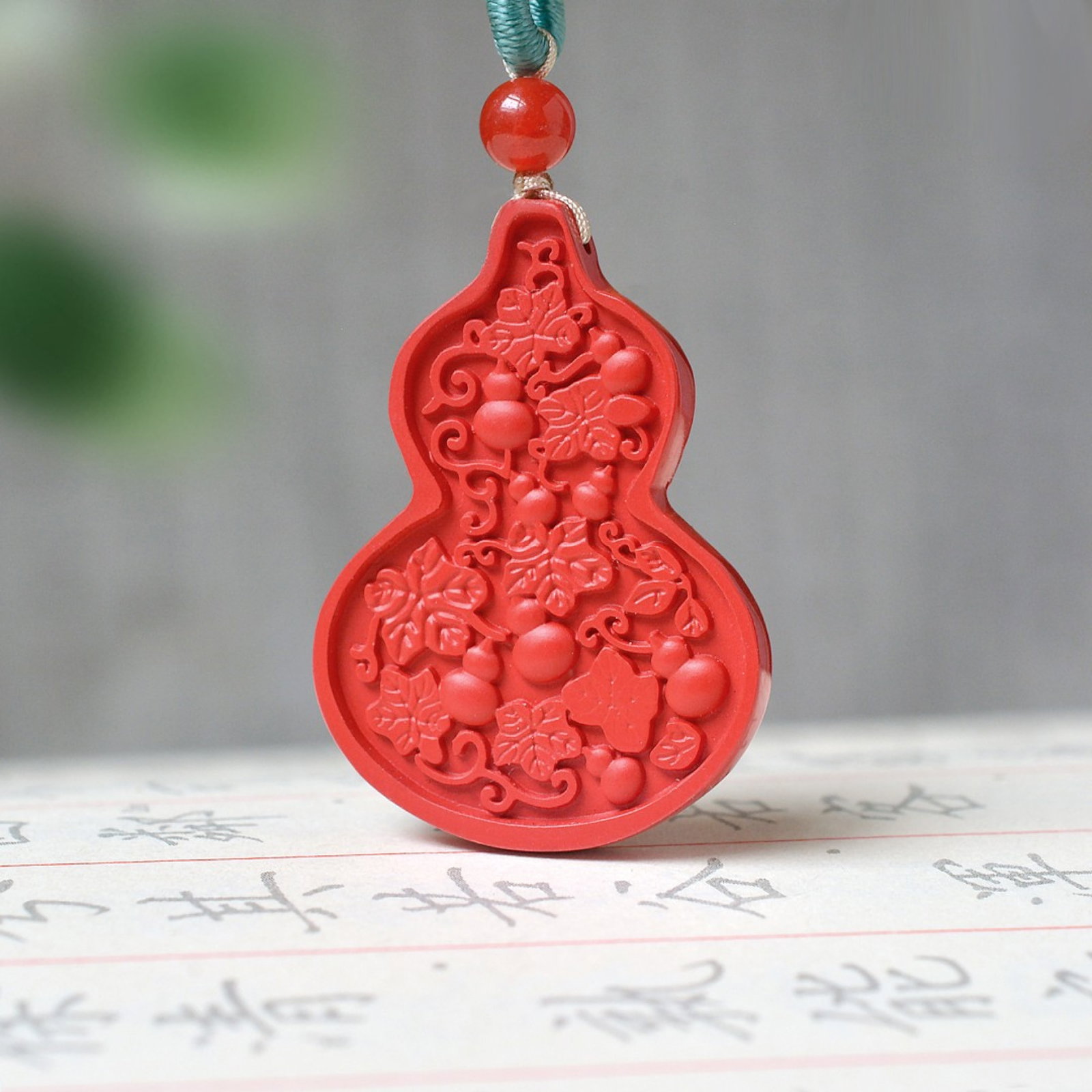 An Exquisite Cinnabar Gourd Pattern Pendant: An Exquisite Cinnabar Gourd Pattern Pendant,Size:0.9inx1.3in,Weight:7g 朱砂葫芦纹挂件