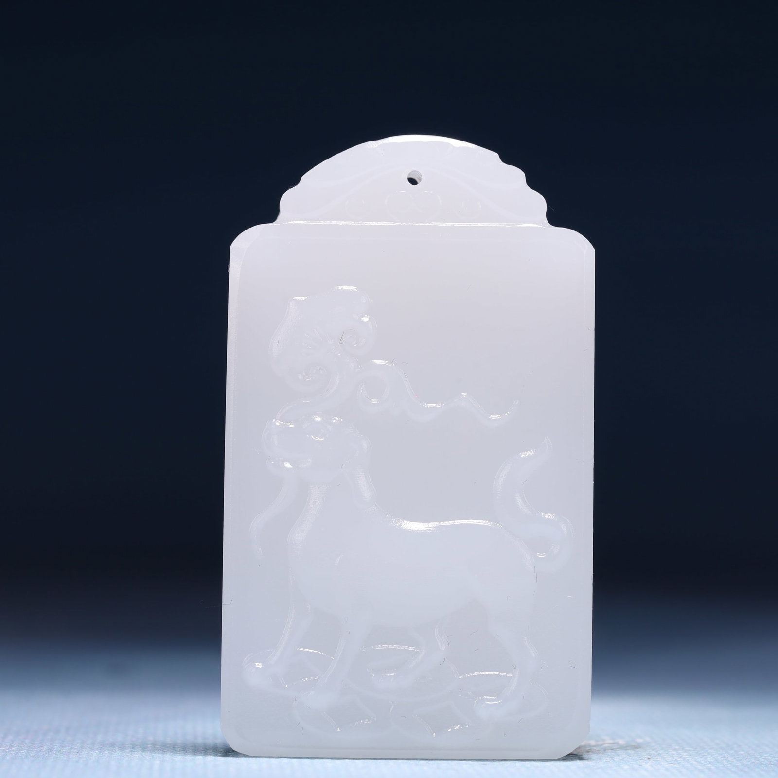 An Exquisite White Jade Dog Pattern Pendant: An Exquisite White Jade Dog Pattern Pendant,Size:1.6inx0.4inx2.4in,Weight:50g 白玉犬纹牌