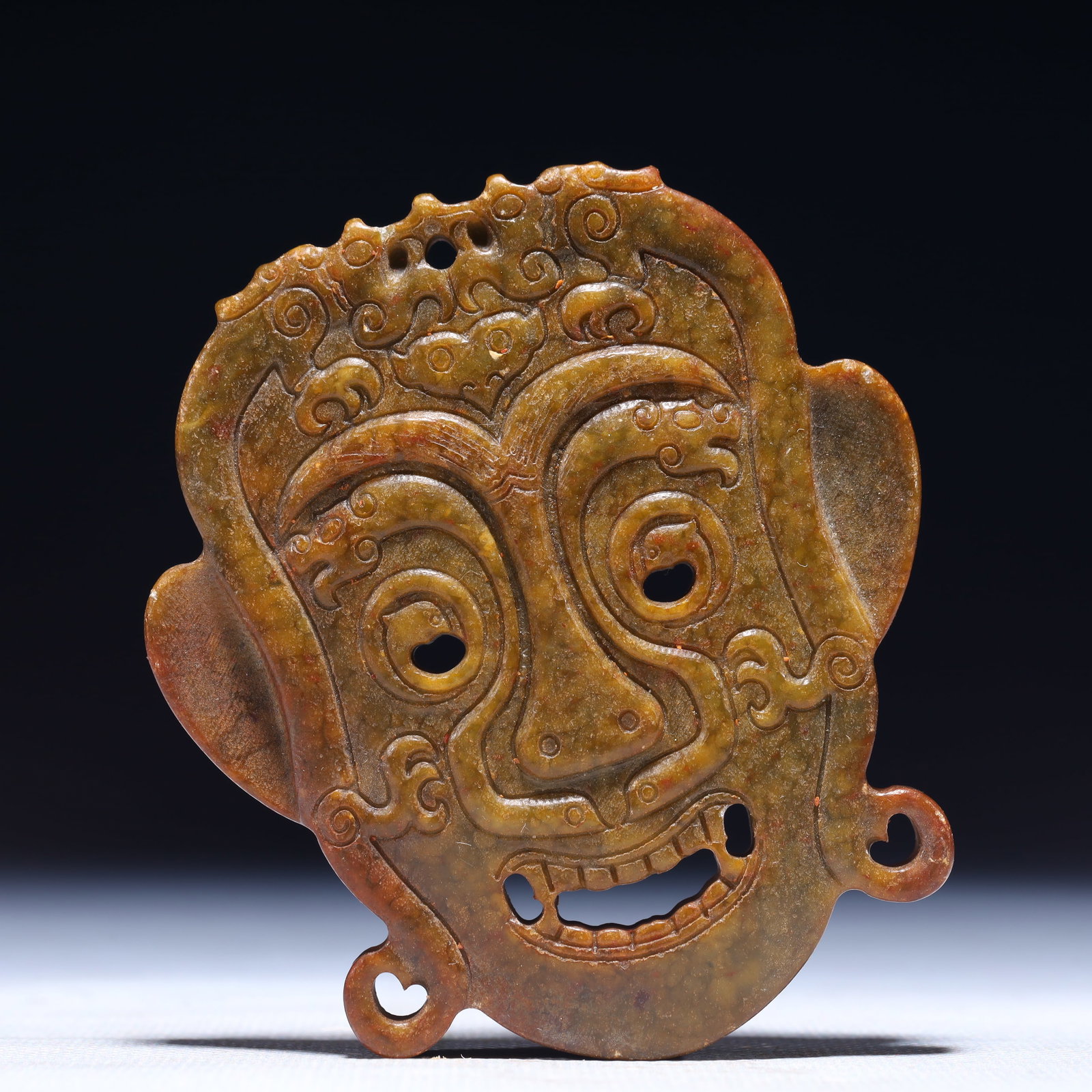 An Exquisite Archaic Jade Figure-Face Pattern Mask (1 of 3)