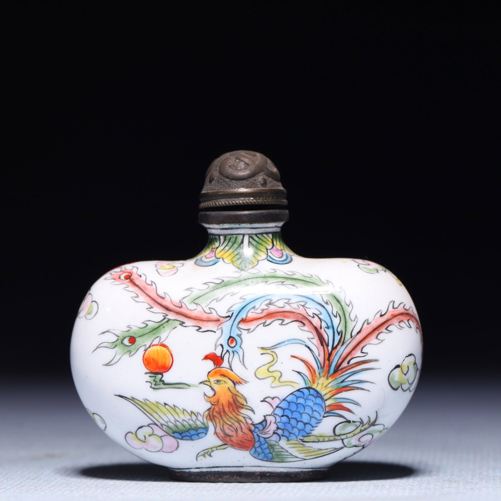 An Exquisite Painted Enamel Dragon and Phoenix Pattern Snuff Bottle: An Exquisite Painted Enamel Dragon and Phoenix Pattern Snuff Bottle,Qing Dynasty,China,Qianlong Four-character Mark,Size:2.2inx0.8inx2in,Weight:59.8g 画珐琅龙凤纹&#