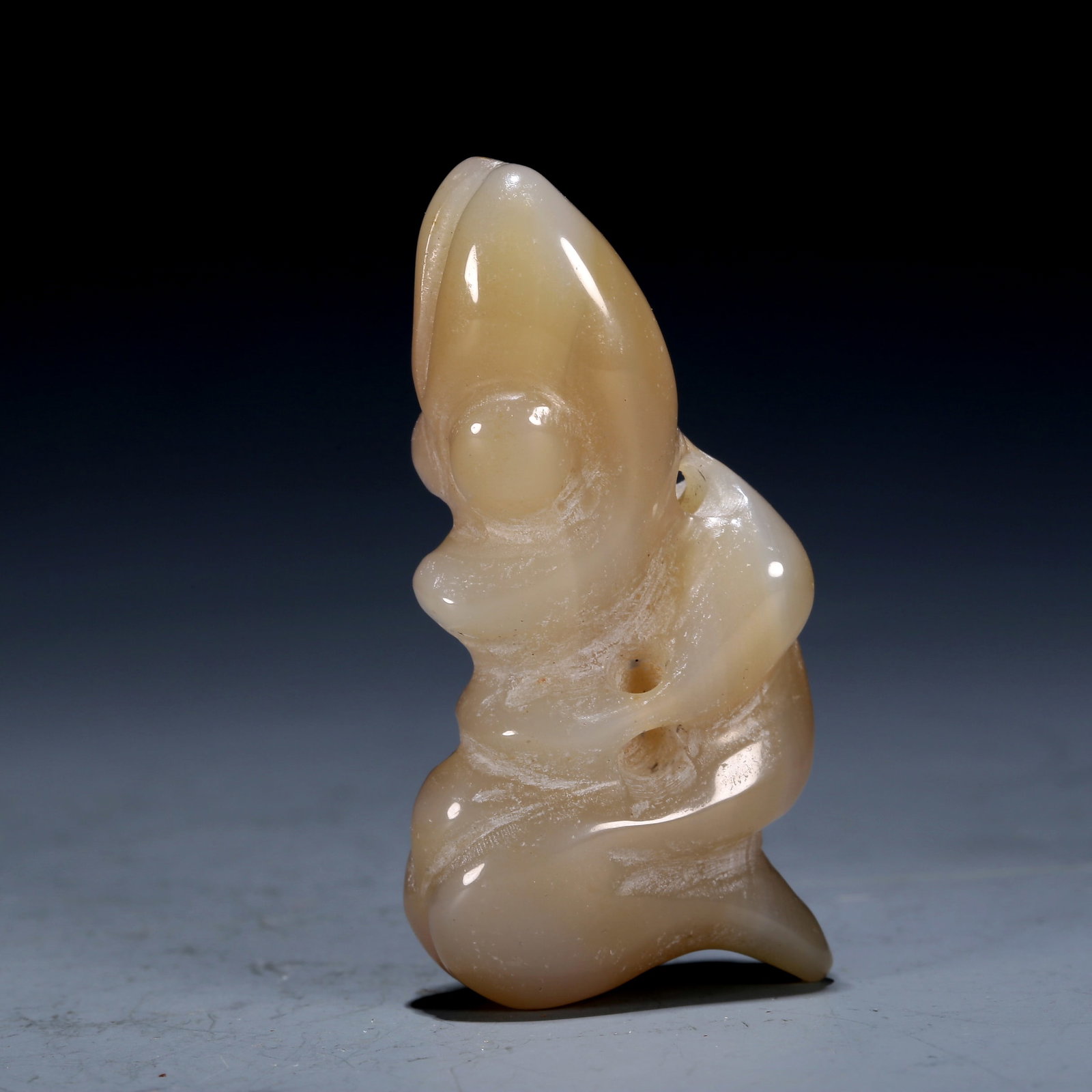 A Hongshan Culture Agate 'Dragon' Pendant: A Hongshan Culture Agate 'Dragon' Pendant Chinese Neolithic Period. Size:1.1inx0.5inx2.2in