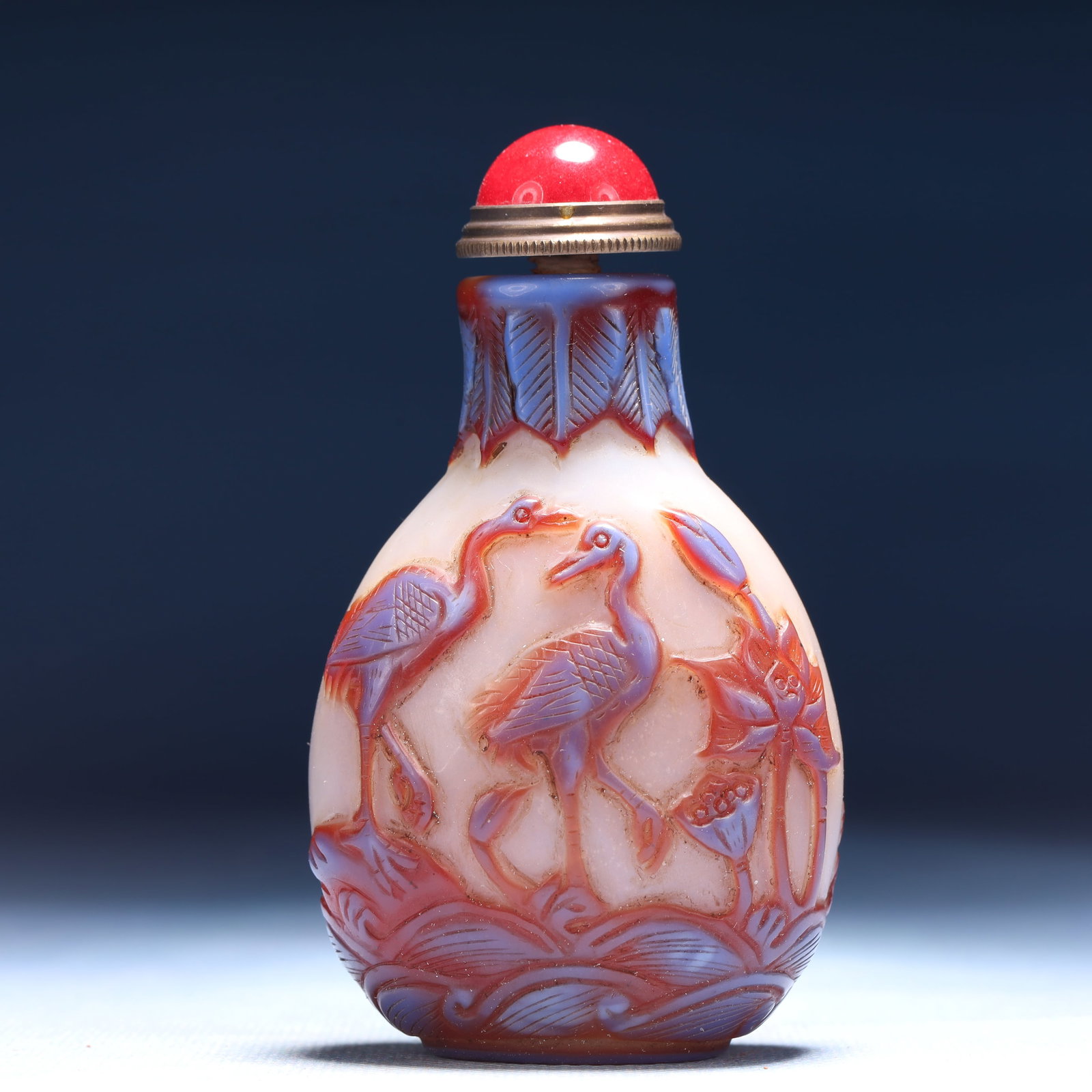 An Exquisite Glass Flower and Crane Pattern Snuff Bottle: An Exquisite Glass Flower and Crane Pattern Snuff Bottle,Qing Dynasty,China,Qianlong Four-character Mark,Size:2inx1.2inx3.5in,Weight:69g 琉璃花卉鹤纹鼻烟