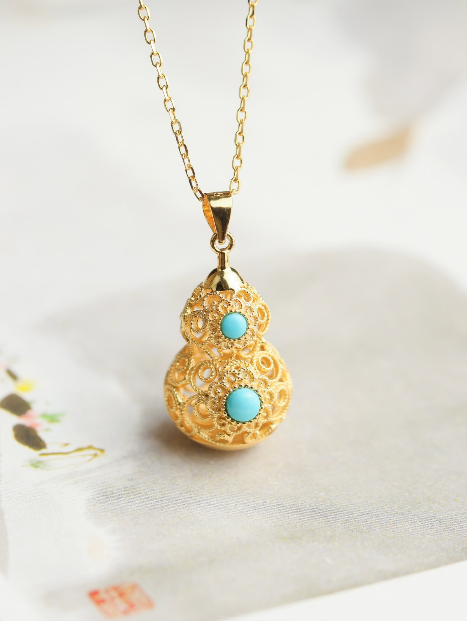 An Exquisite Sterling Silver-Gold Plated Inlaid Turquoise Gourd Pendant: An Exquisite Sterling Silver-Gold Plated Inlaid Turquoise Gourd Pendant 纯银镀金镶绿松石葫芦吊坠