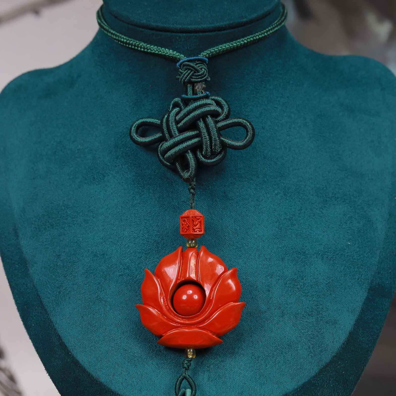 An Exquisite Cinnabar Lotus Pattern Pendant: An Exquisite Cinnabar Lotus Pattern Pendant, Size:1.6inx2in, Weight:48g 朱砂莲花挂件