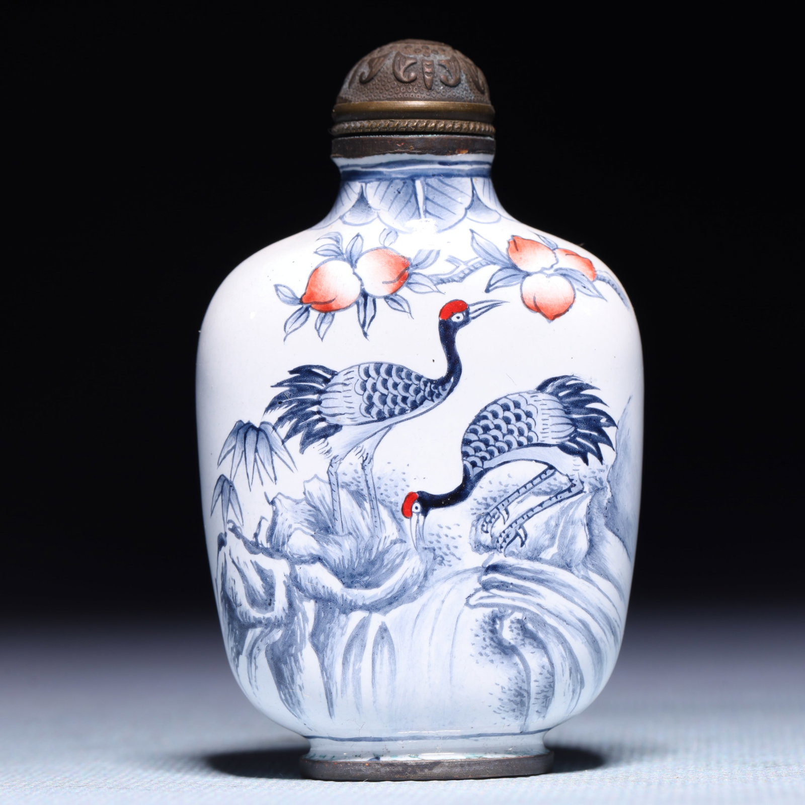 An Exquisite Painted Enamel Pine and Crane Pattern Snuff Bottle: An Exquisite Painted Enamel Pine and Crane Pattern Snuff Bottle,Qing Dynasty,China,Qianlong Four-character Mark,Size:1.6inx0.8inx2.8in,Weight:67g 画珐琅松鹤纹࿬
